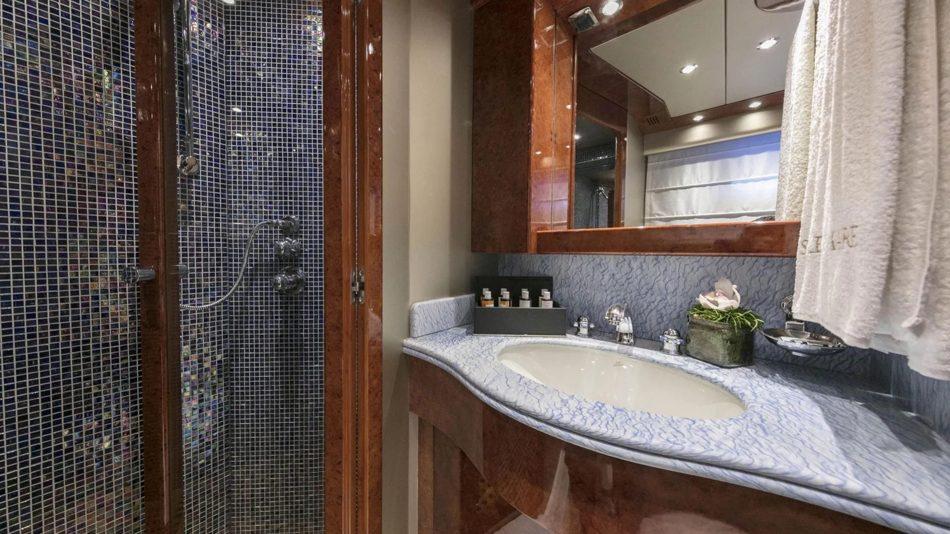 a bathroom with a sink and a mirror aboard SOLE DI MARE Yacht for Sale