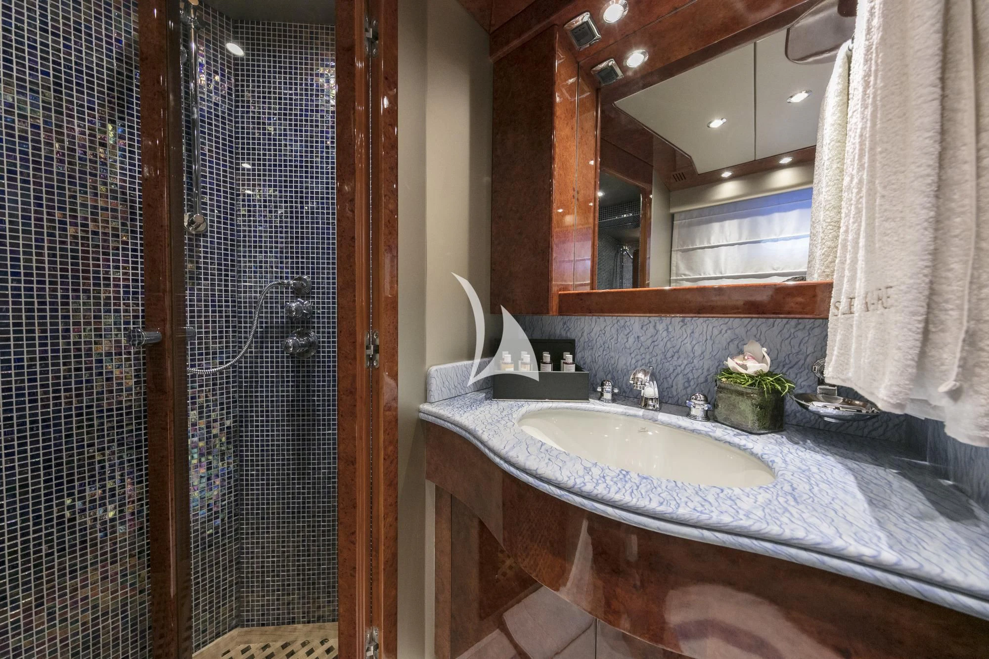 a bathroom with a sink and a mirror aboard SOLE DI MARE Yacht for Sale
