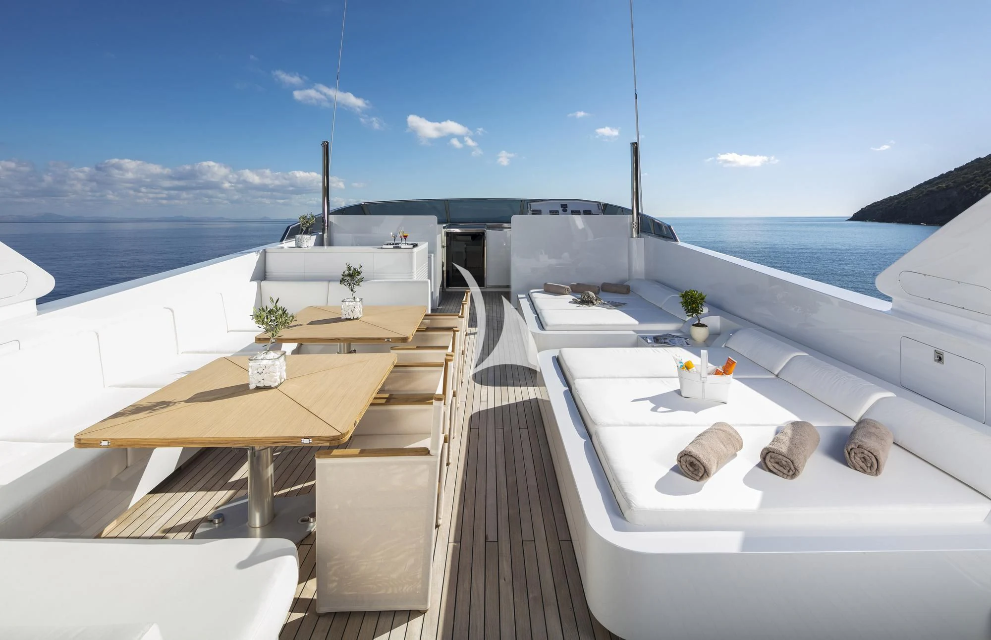 a room with a table and chairs aboard SOLE DI MARE Yacht for Sale