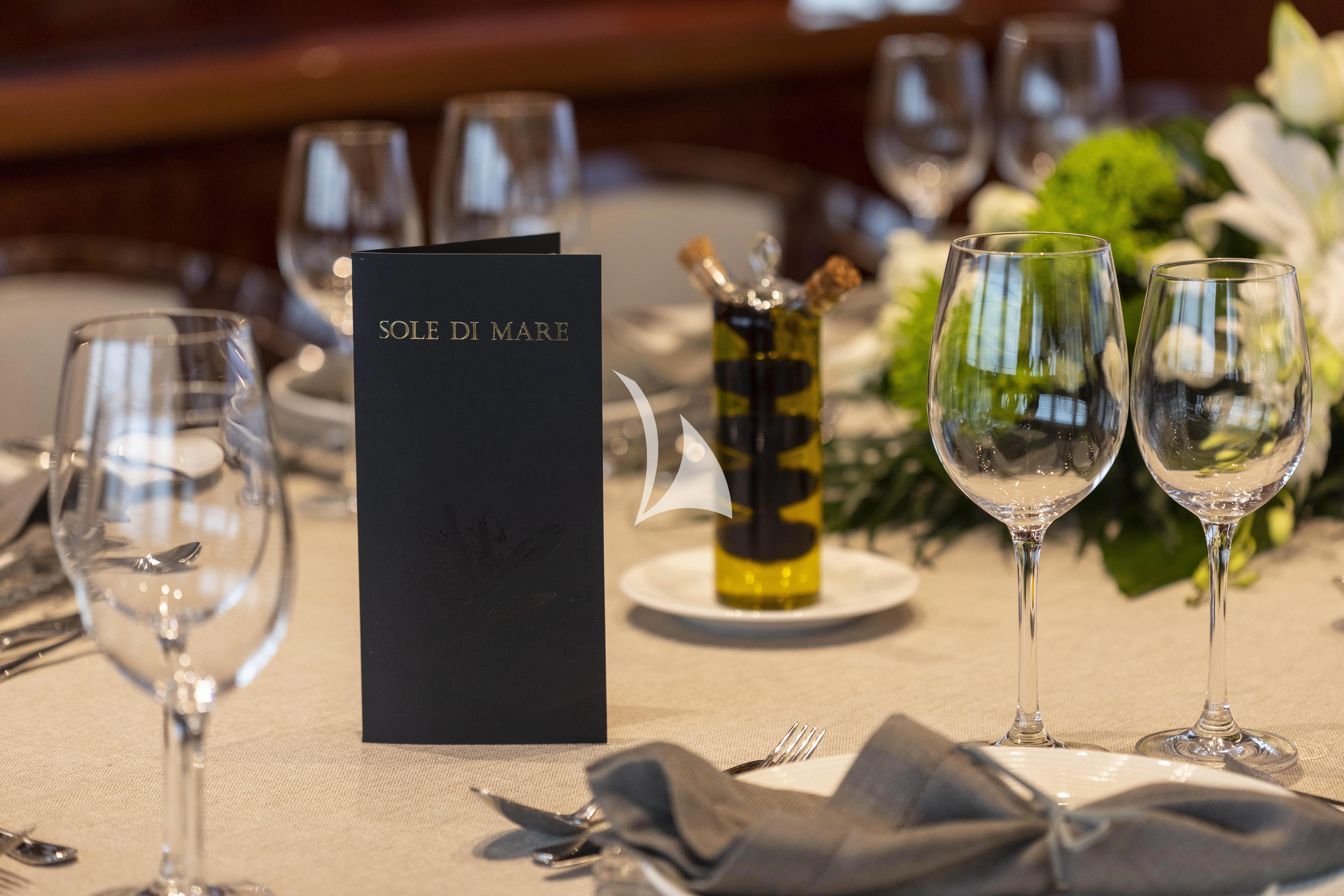 a menu on a table aboard SOLE DI MARE Yacht for Sale