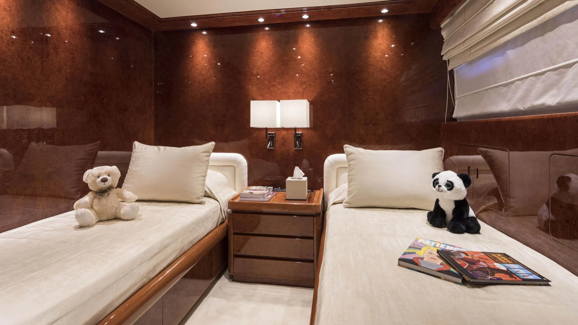 a couple of stuffed animals sit on a bed aboard SOLE DI MARE Yacht for Sale
