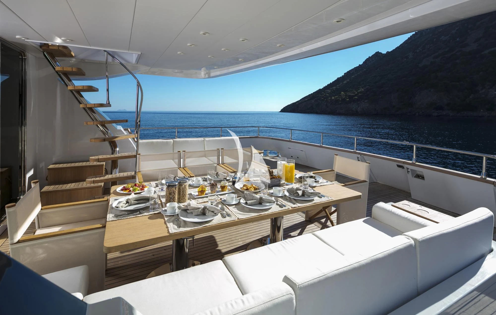 a room with a table and chairs aboard SOLE DI MARE Yacht for Sale