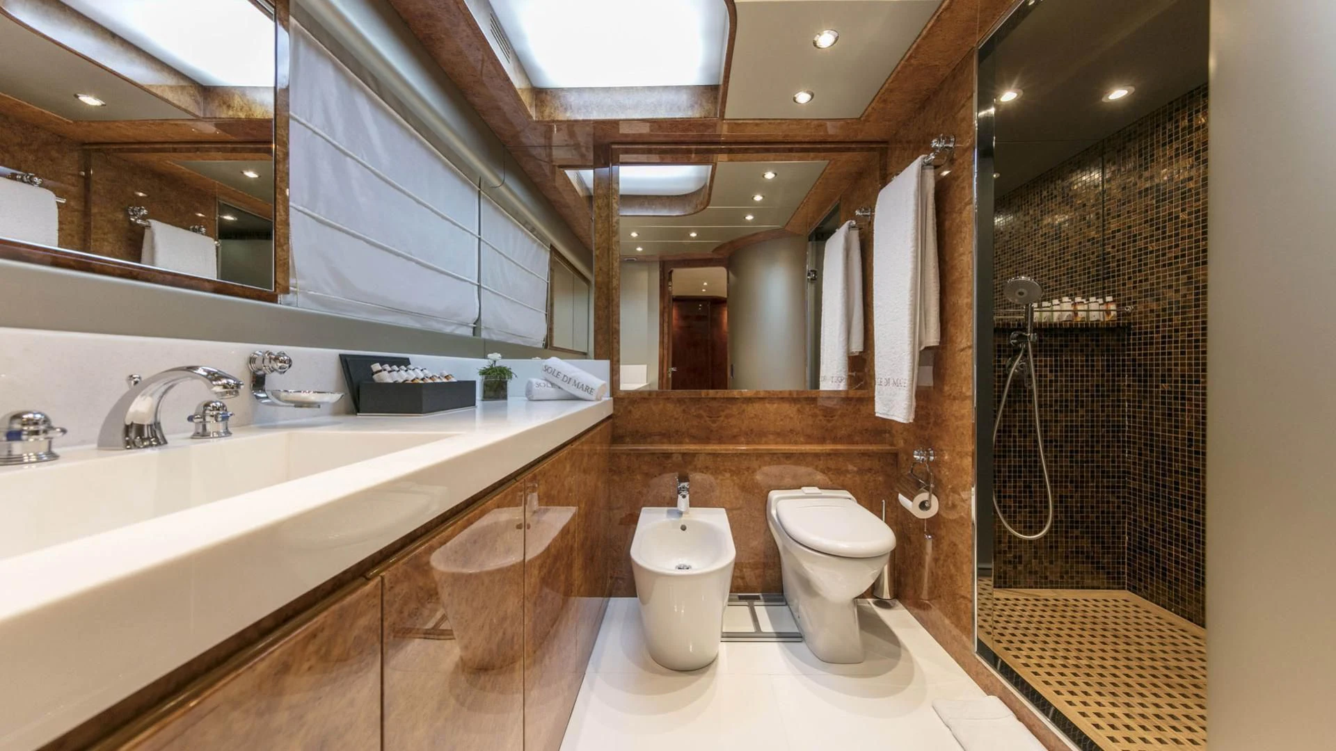 a bathroom with a toilet and a sink aboard SOLE DI MARE Yacht for Sale