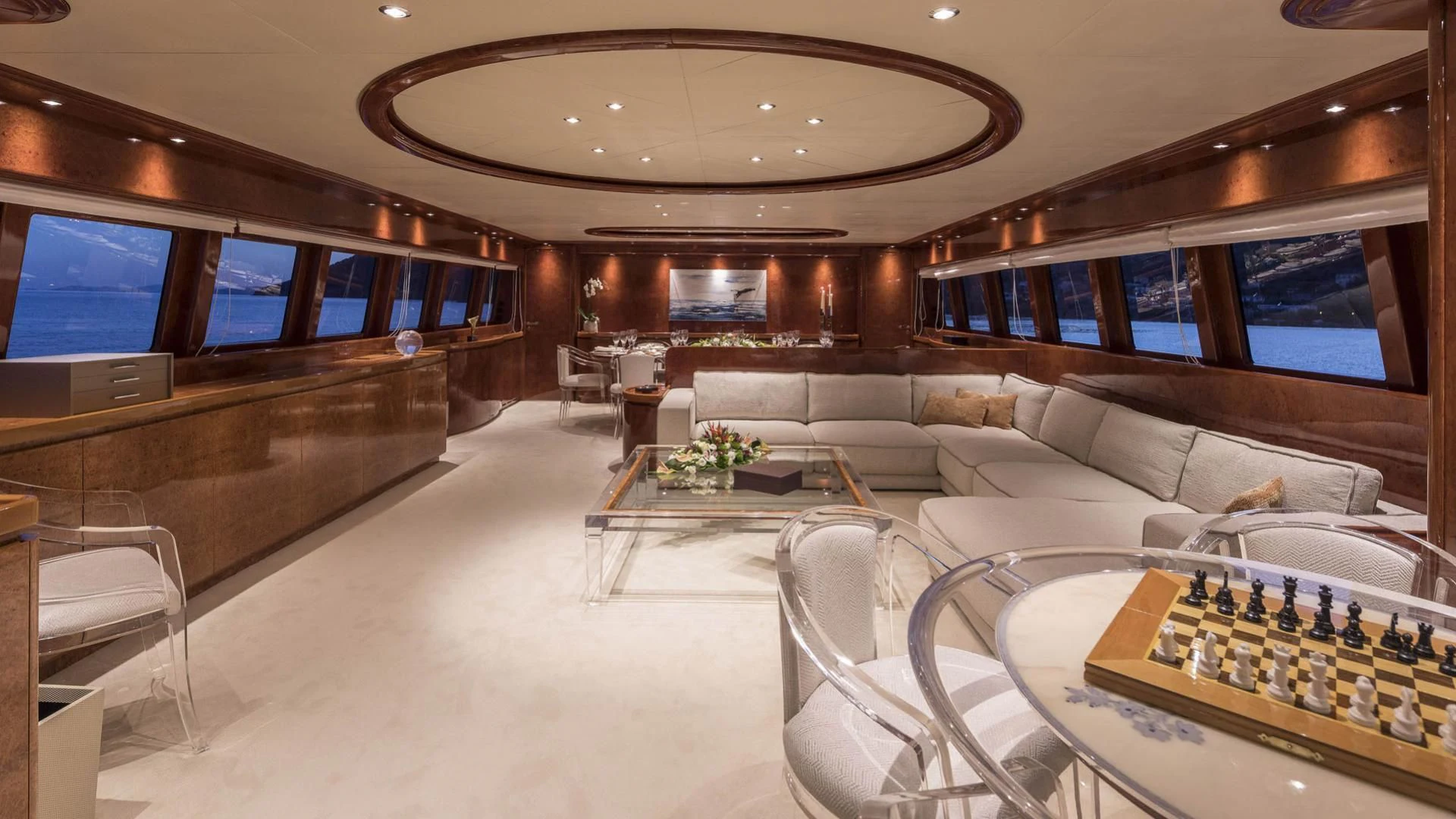 a living room with a large screen aboard SOLE DI MARE Yacht for Sale