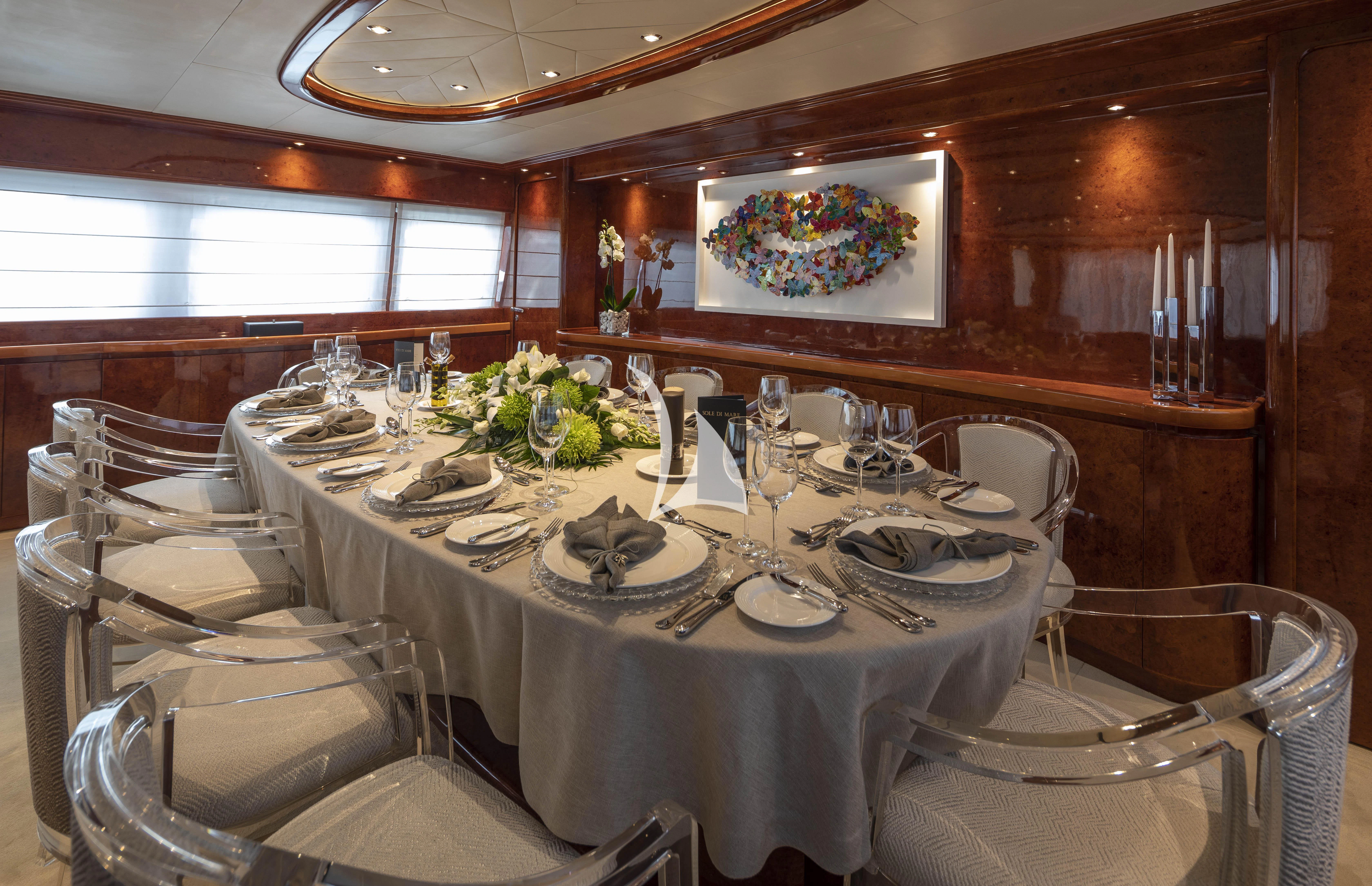 a dining table set for a dinner aboard SOLE DI MARE Yacht for Sale