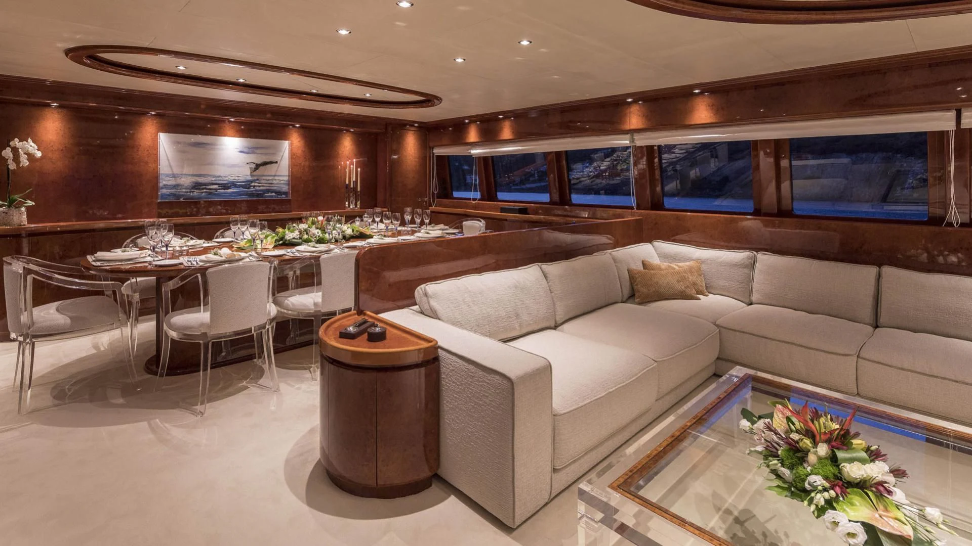 a living room with a couch and a table aboard SOLE DI MARE Yacht for Sale