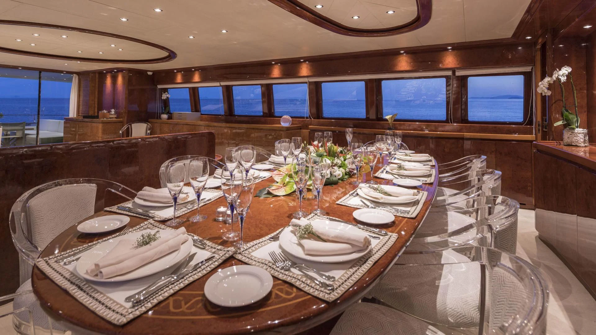 a table set with plates and glasses aboard SOLE DI MARE Yacht for Sale