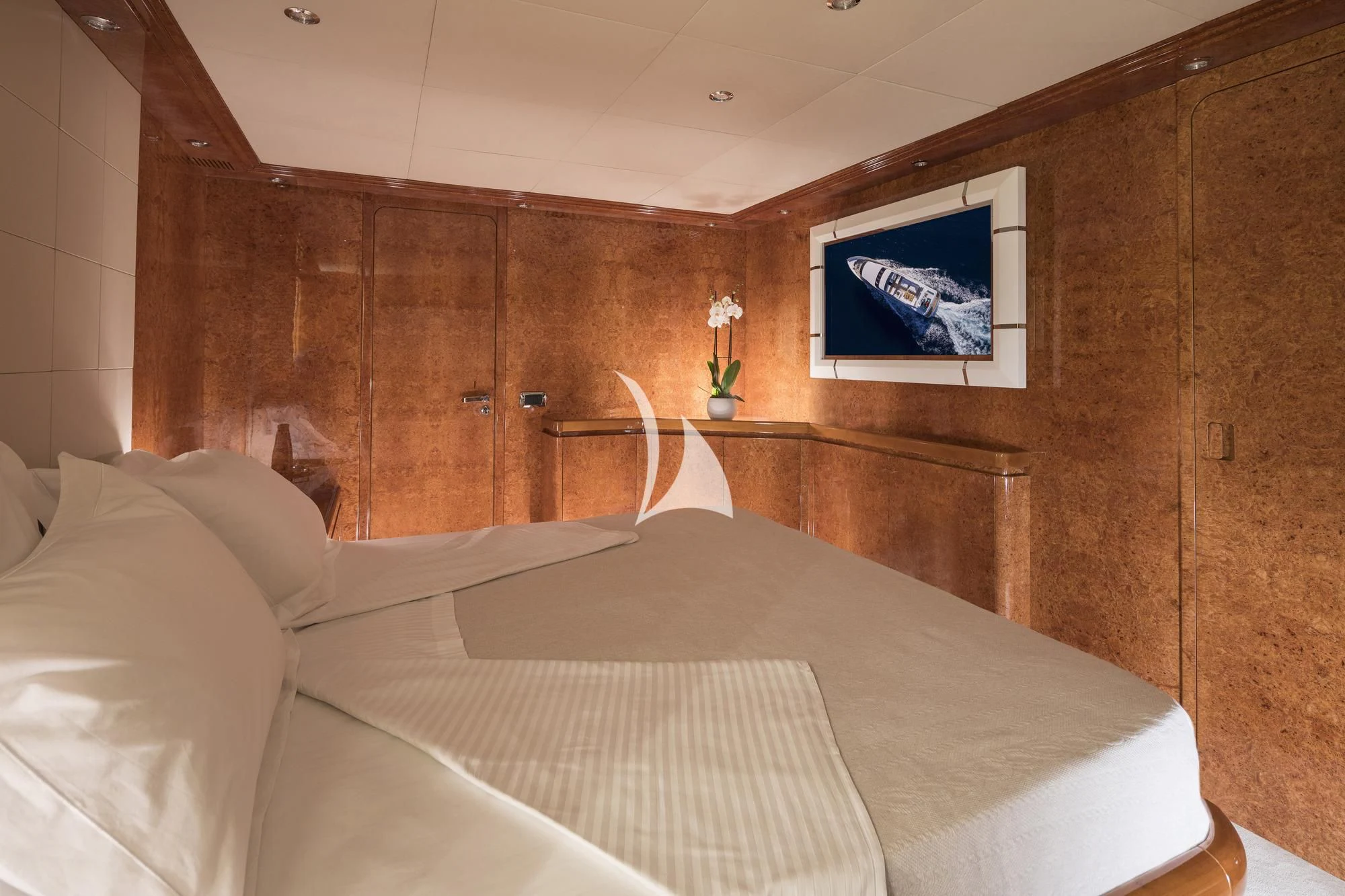 a room with a bed and a television aboard SOLE DI MARE Yacht for Sale