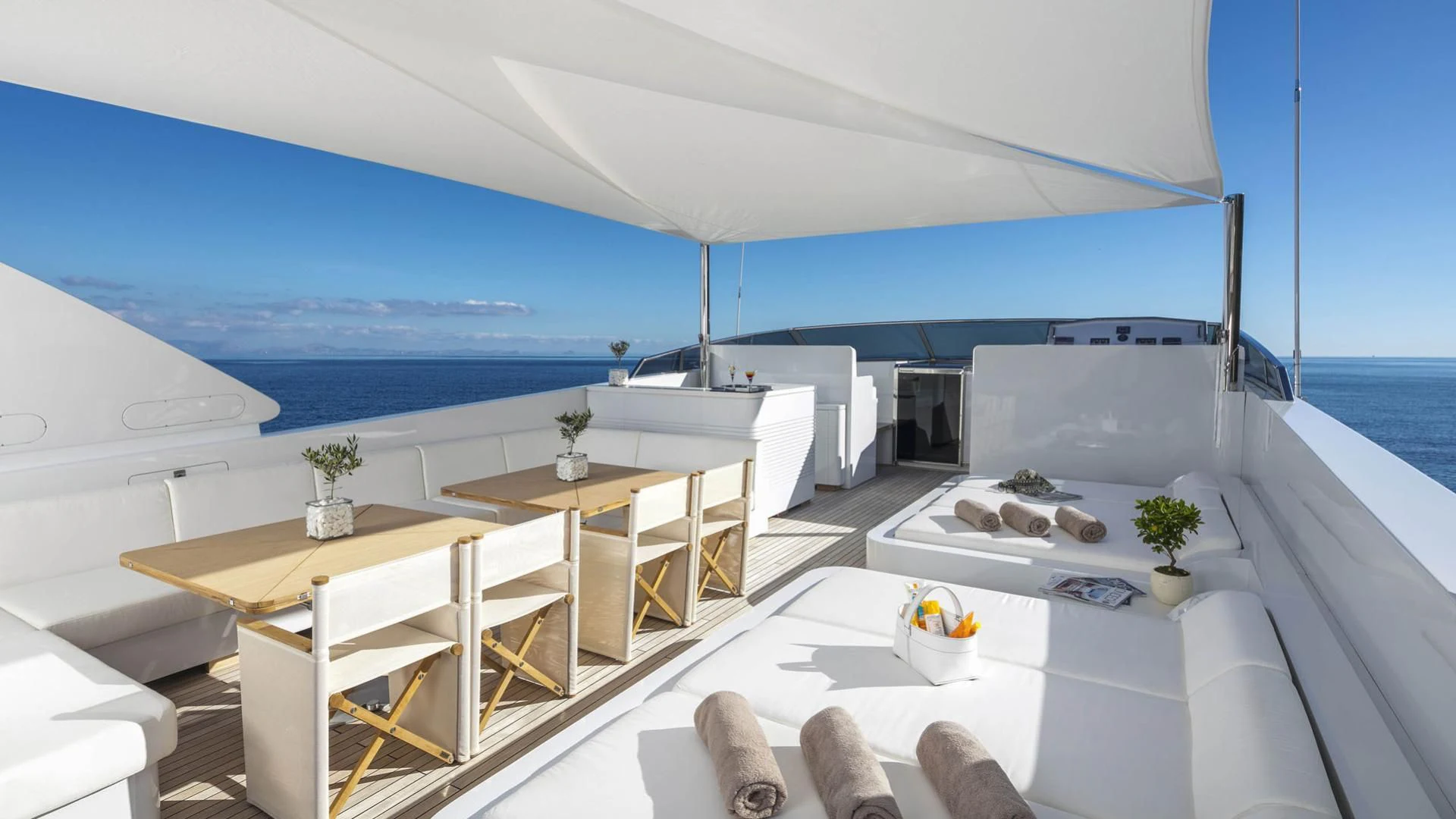 a room with a table and chairs aboard SOLE DI MARE Yacht for Sale