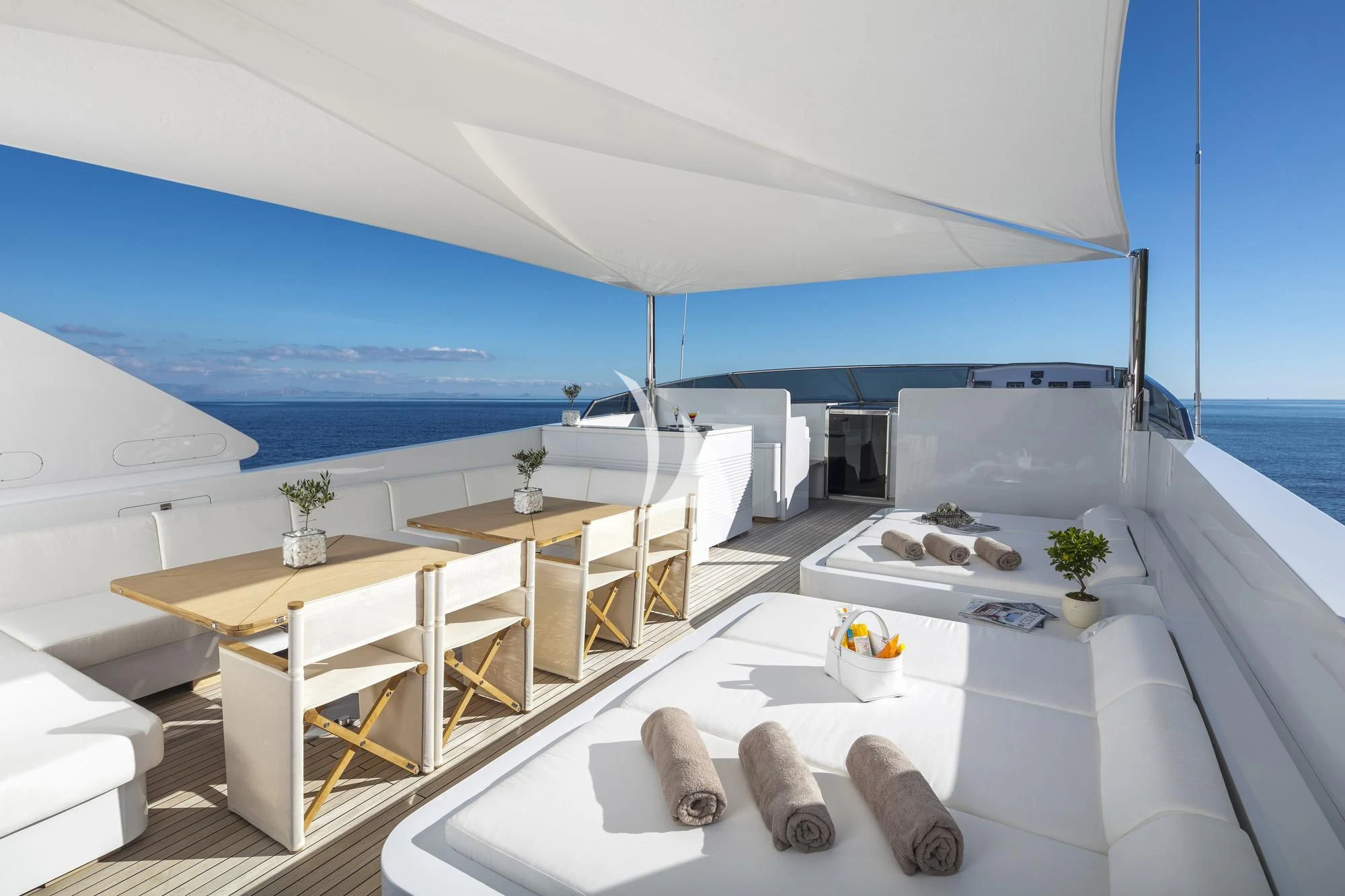 a room with a table and chairs aboard SOLE DI MARE Yacht for Sale