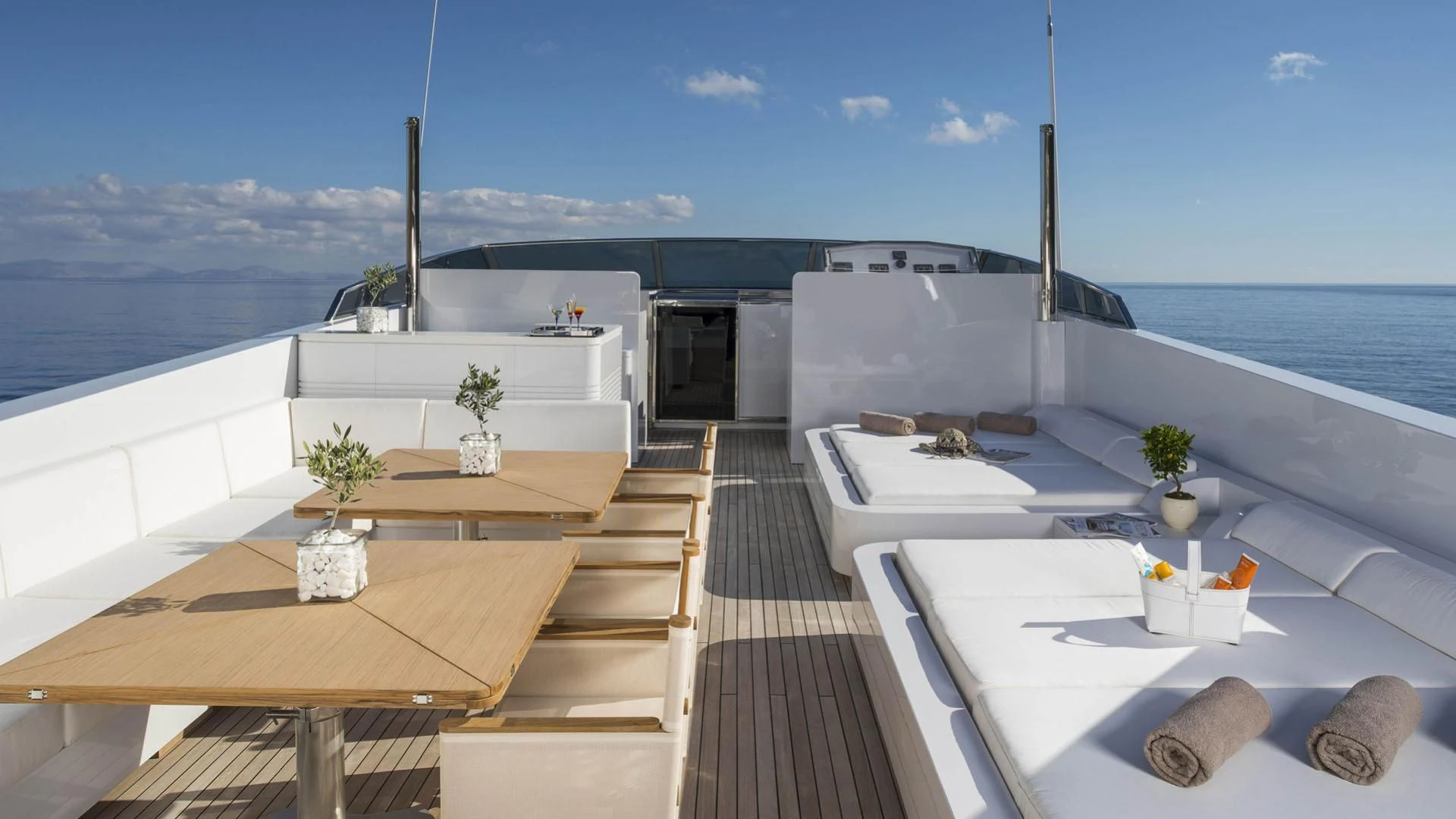 a deck with a pool and a deck with a view of the ocean aboard SOLE DI MARE Yacht for Sale