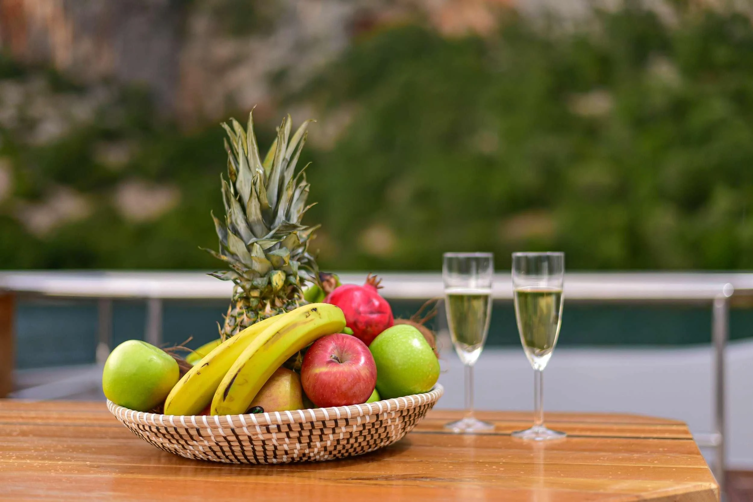 a basket of fruits and wine aboard STELA 117 Yacht for Sale