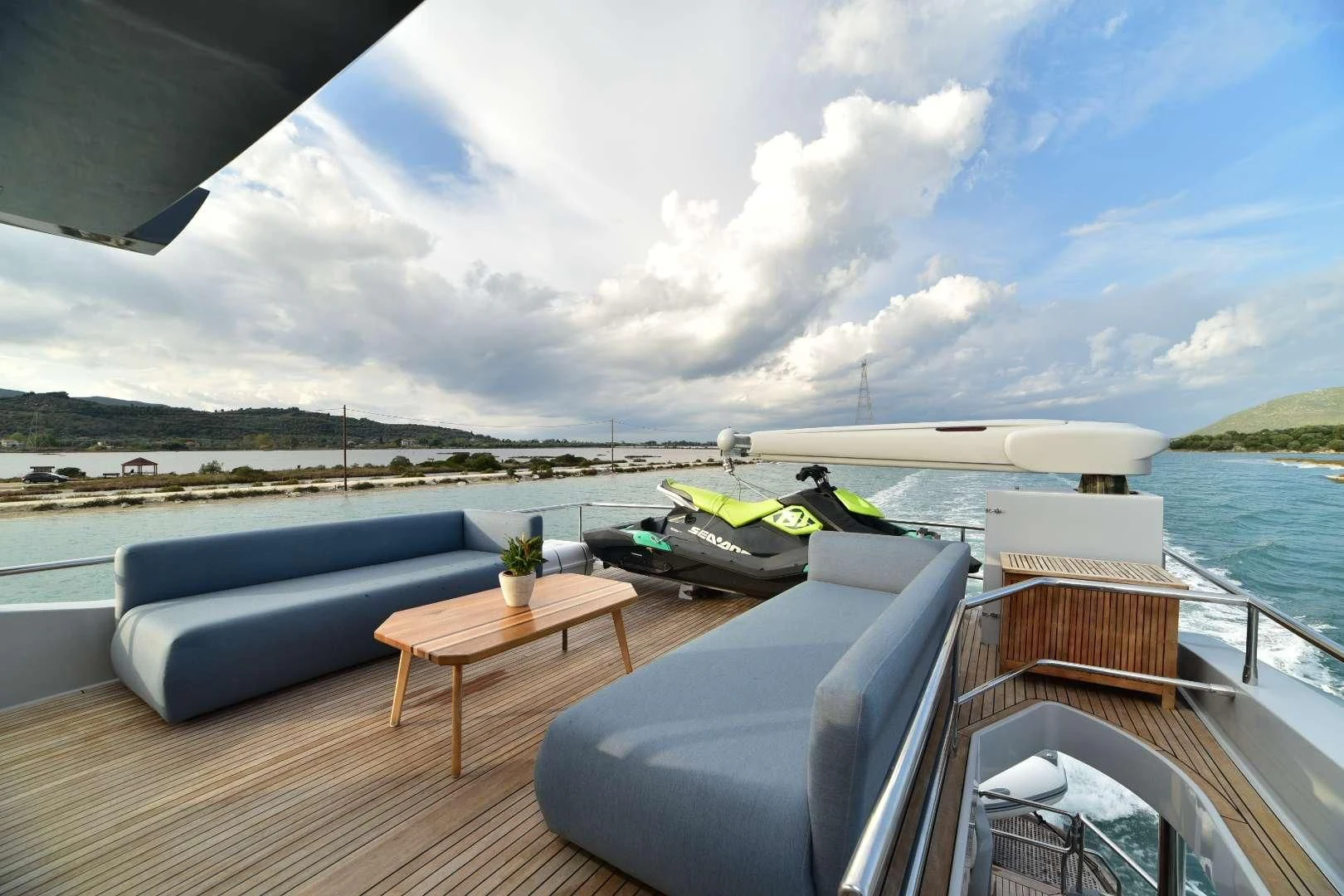 a deck with a table and chairs on it aboard STELA 117 Yacht for Sale