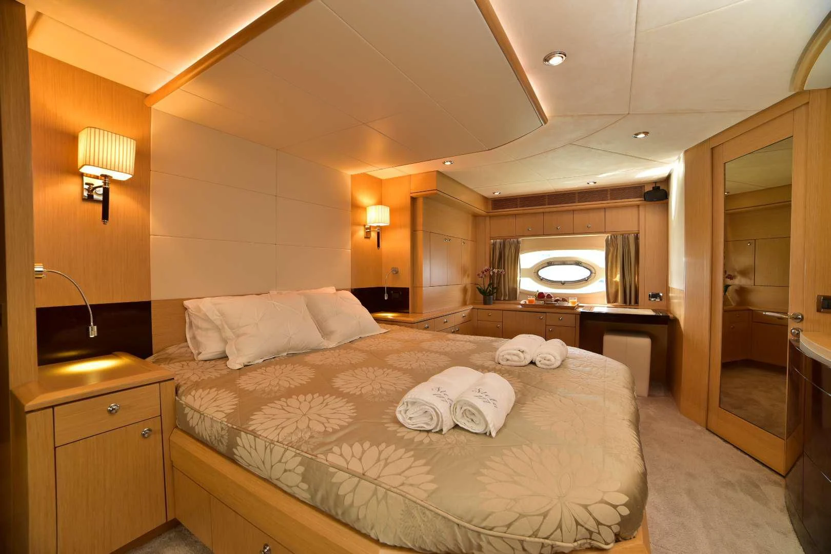 a large bedroom with a large bed aboard STELA 117 Yacht for Sale