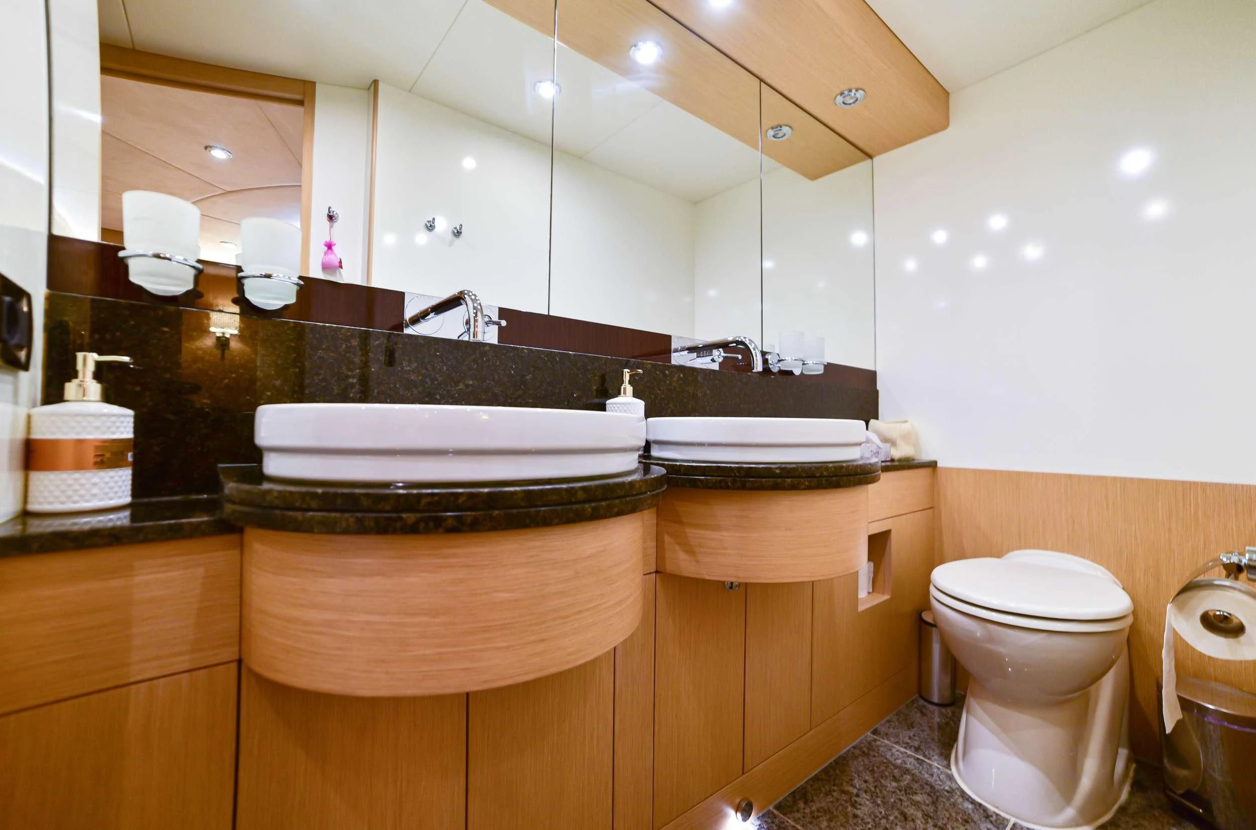 a bathroom with a large mirror aboard STELA 117 Yacht for Sale