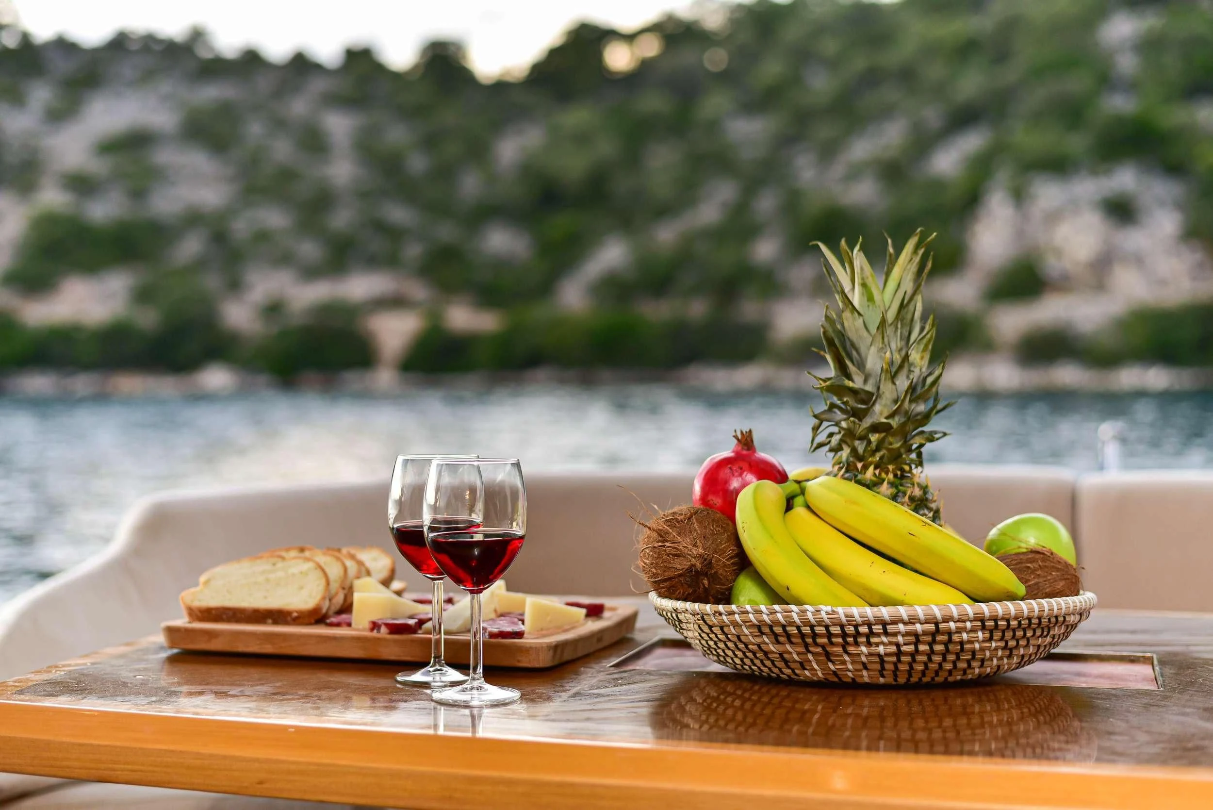 a glass of wine on a table aboard STELA 117 Yacht for Sale