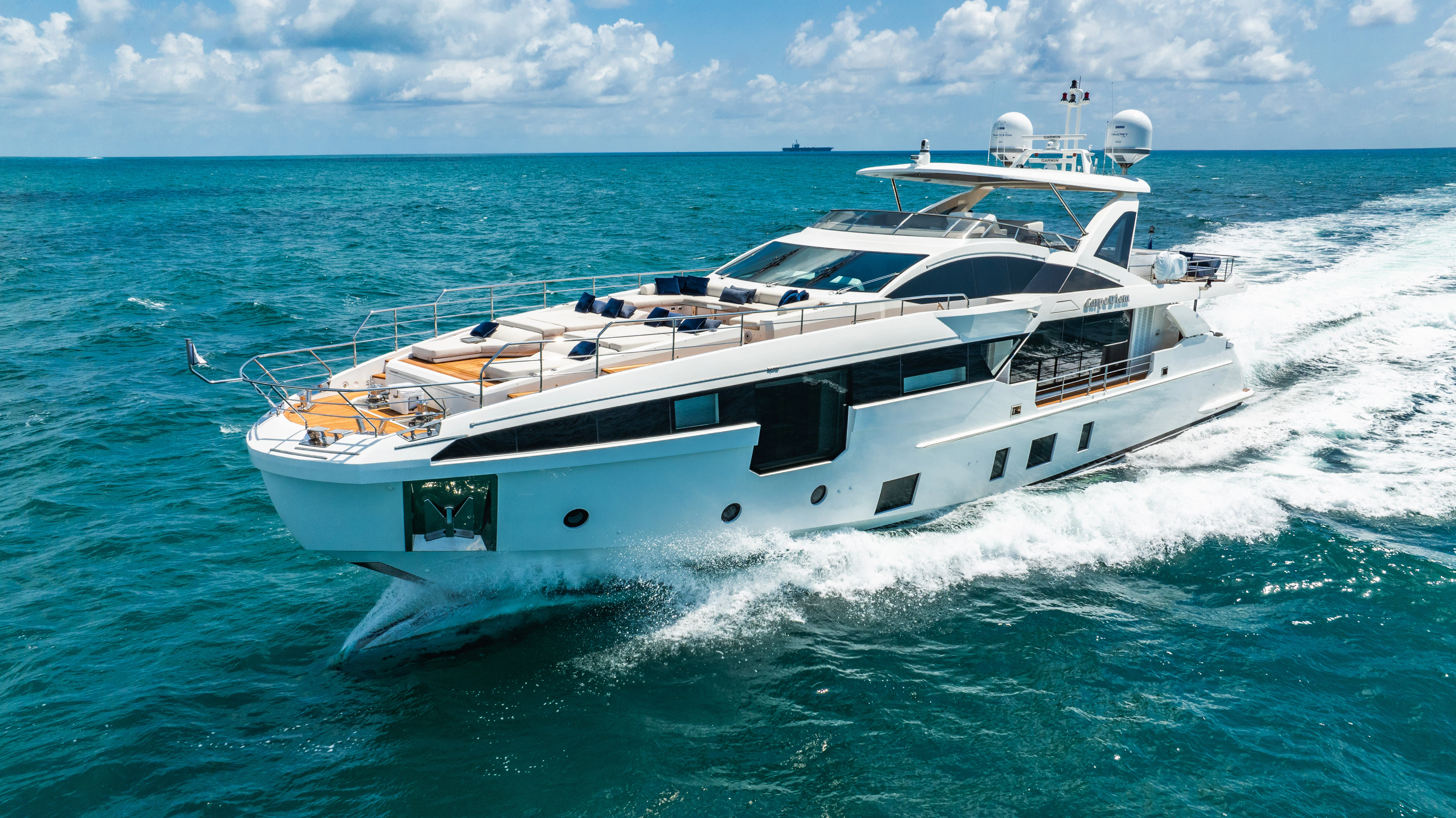 a white yacht in the ocean aboard CARPE DIEM Yacht for Sale