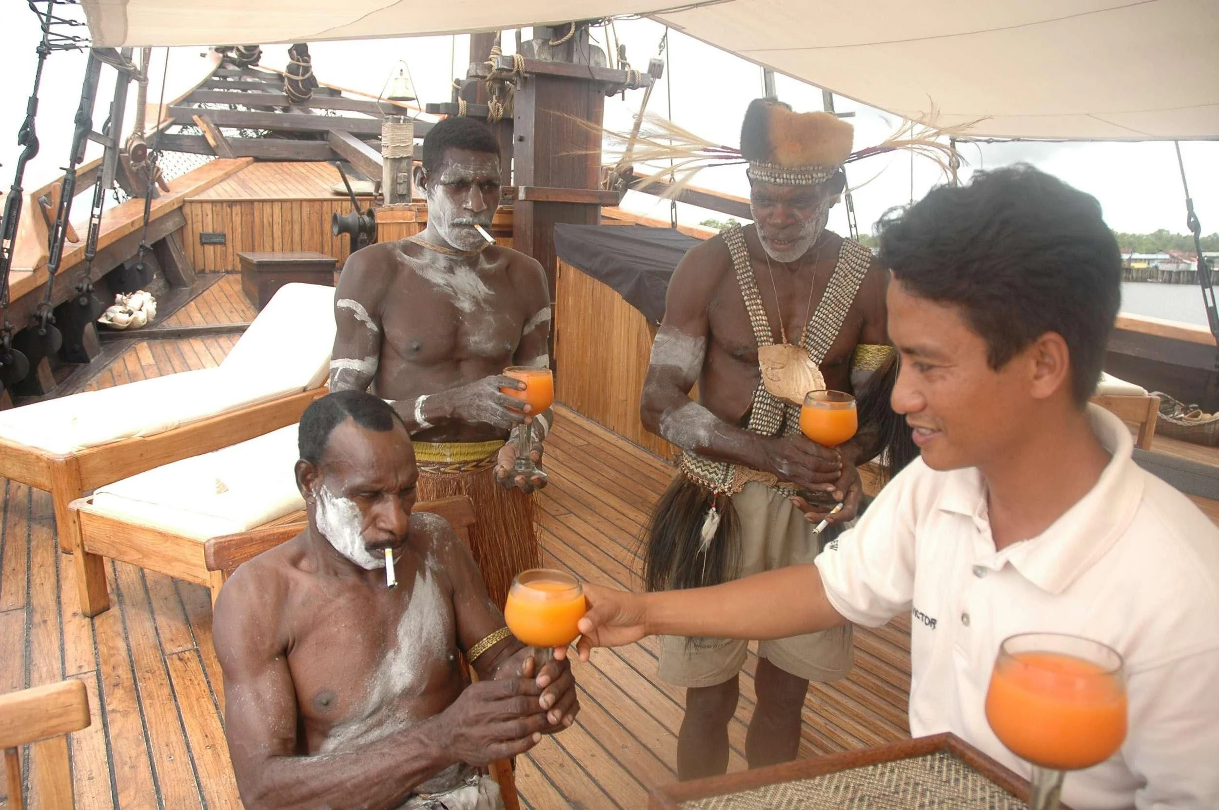a group of people in a room aboard SILOLONA Yacht for Sale
