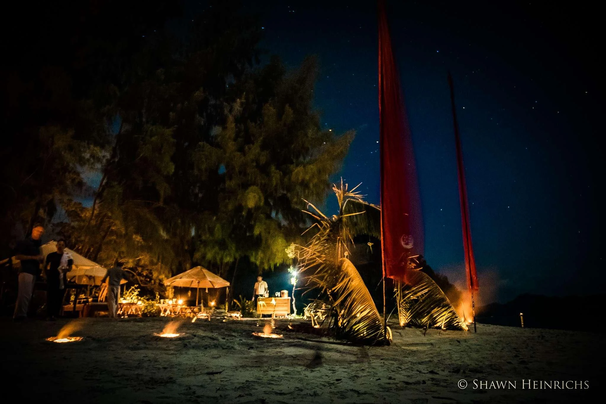 a group of people around a fire aboard SILOLONA Yacht for Sale