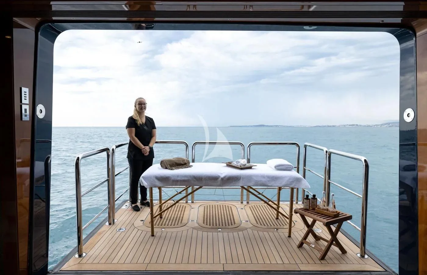 a person standing on a deck of a ship aboard BATELLO Yacht for Sale