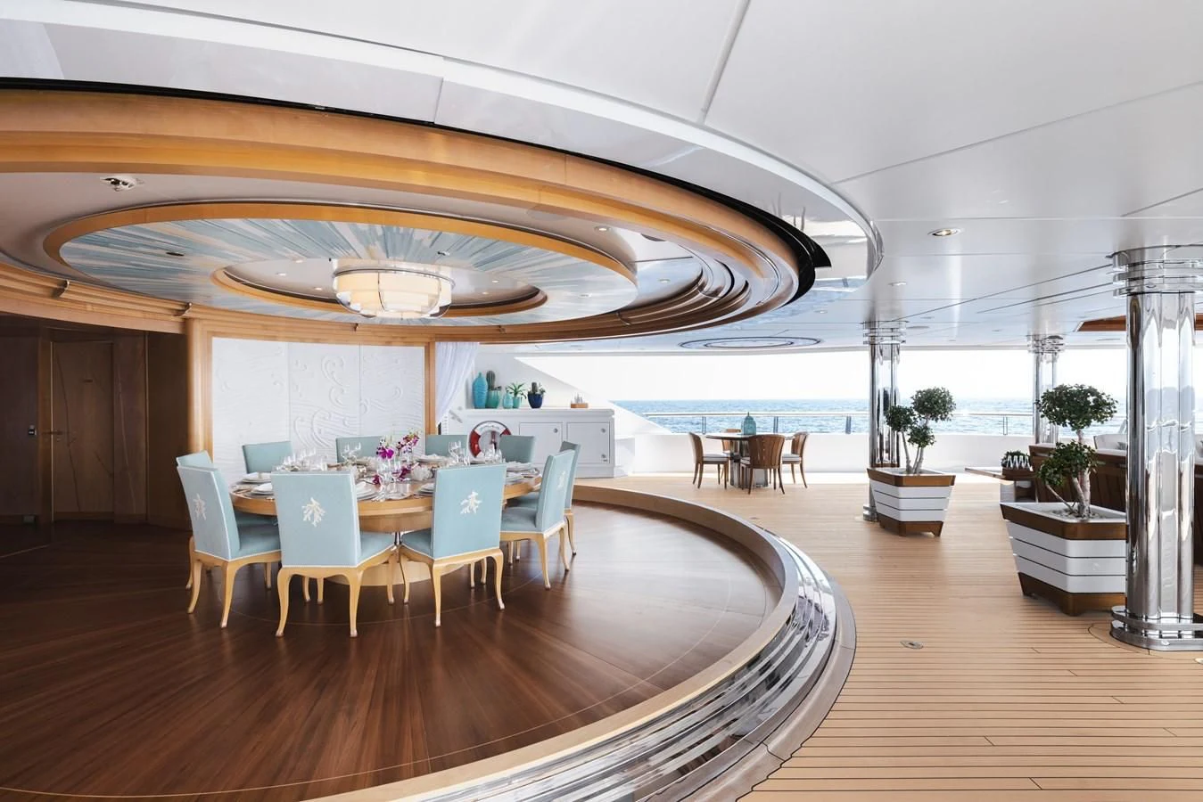 a room with a large table and chairs and a large open space aboard BATELLO Yacht for Sale