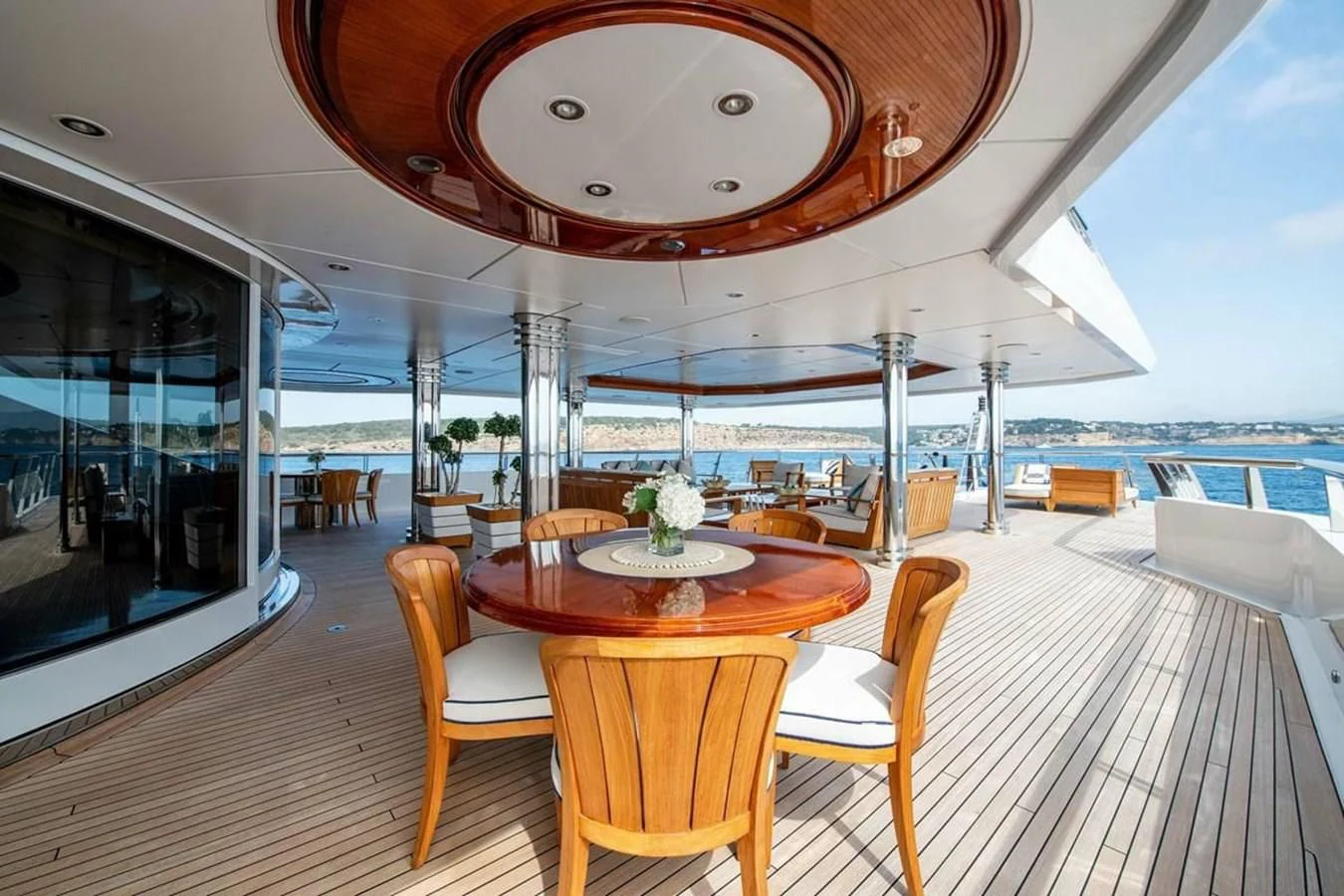 a room with a table and chairs aboard BATELLO Yacht for Sale
