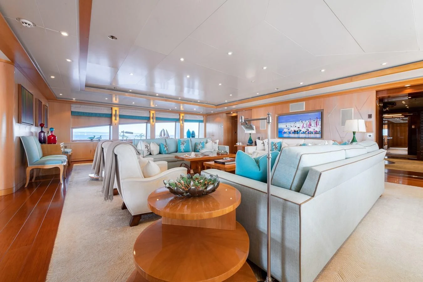 a large living room with a large window aboard BATELLO Yacht for Sale