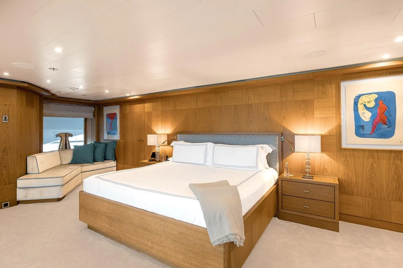 a bedroom with a bed and a couch aboard BATELLO Yacht for Sale