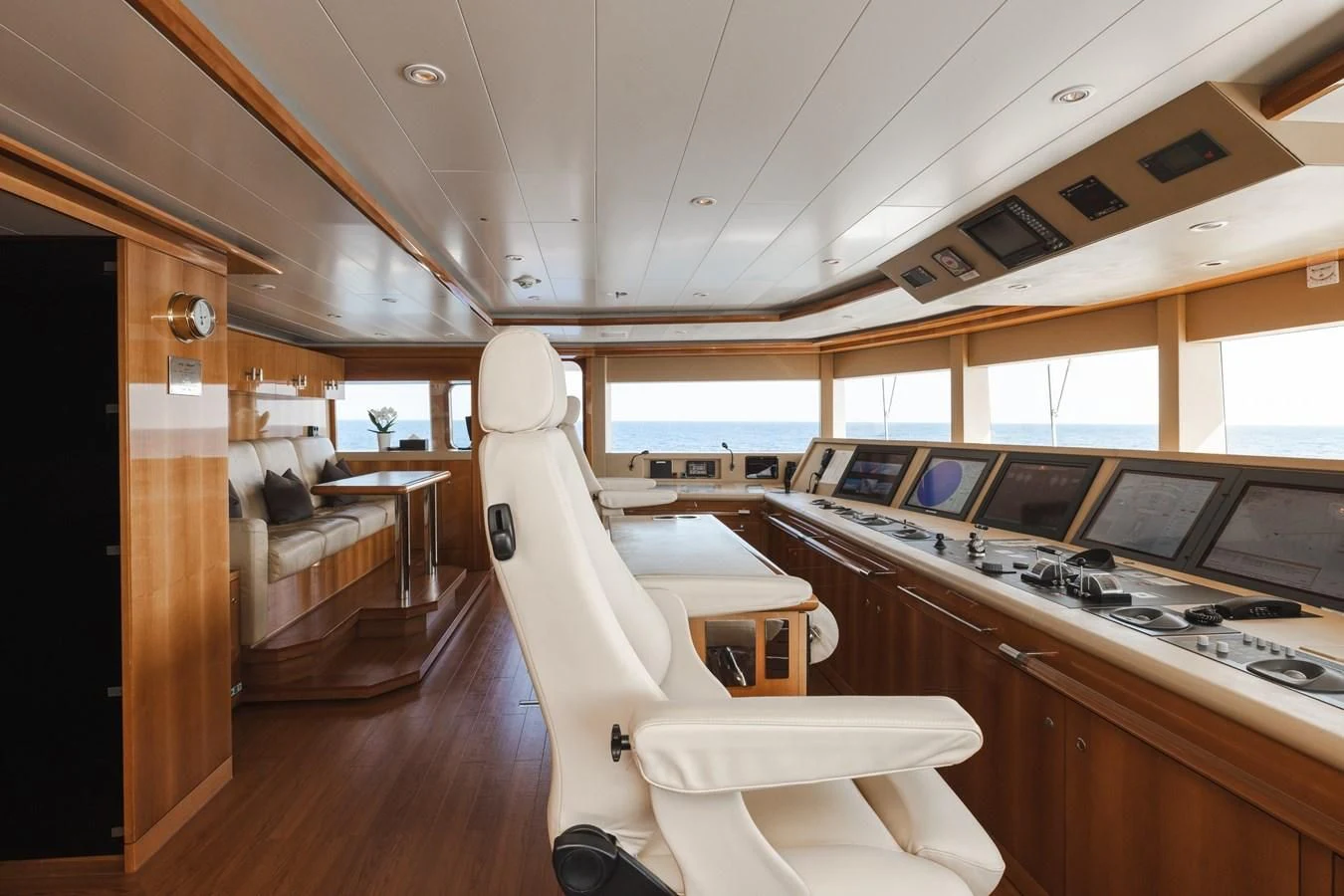 a room with a chair and a table and a couch aboard BATELLO Yacht for Sale
