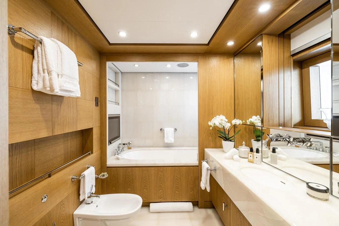 a bathroom with a tub sink and a sink aboard BATELLO Yacht for Sale