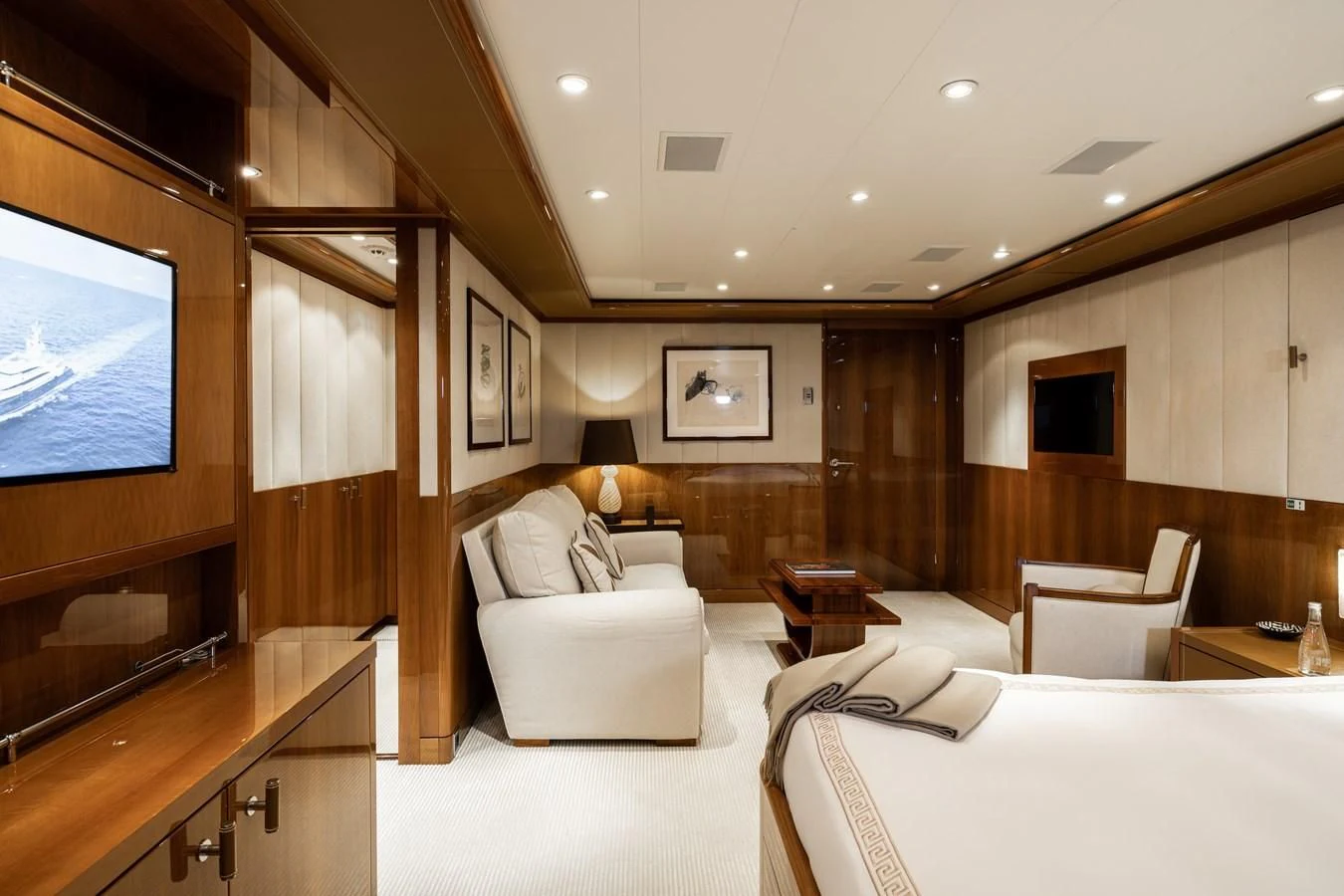 a room with a bed and a tv aboard BATELLO Yacht for Sale