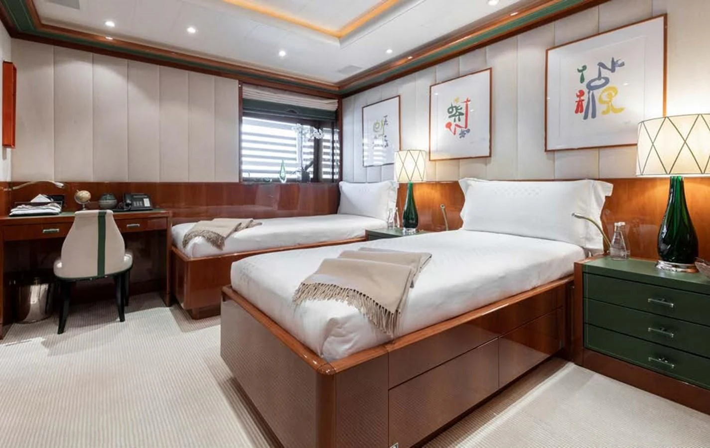 a room with a bed and a desk aboard BATELLO Yacht for Sale