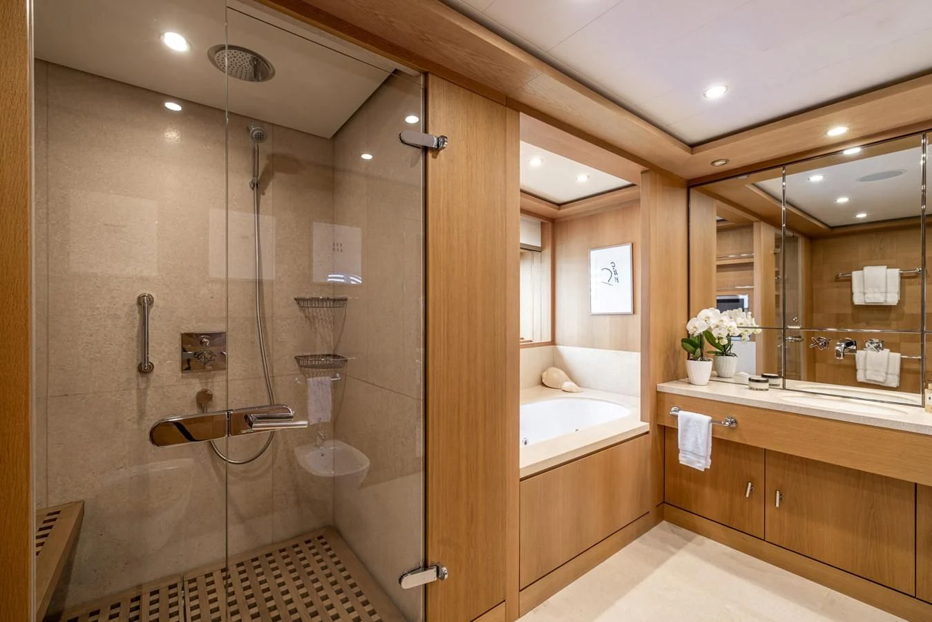 a bathroom with a glass shower aboard BATELLO Yacht for Sale