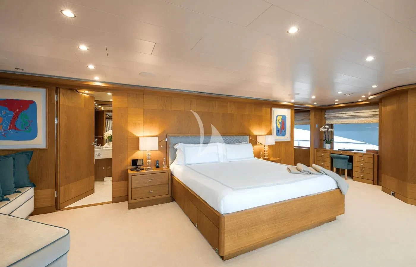 a large bedroom with a large bed aboard BATELLO Yacht for Sale
