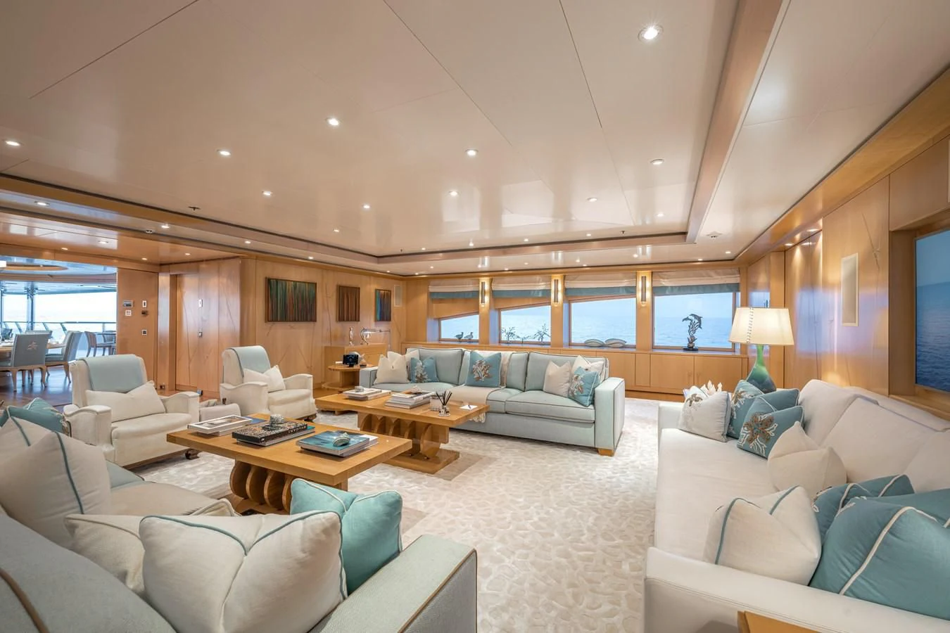 a living room with a large window aboard BATELLO Yacht for Sale