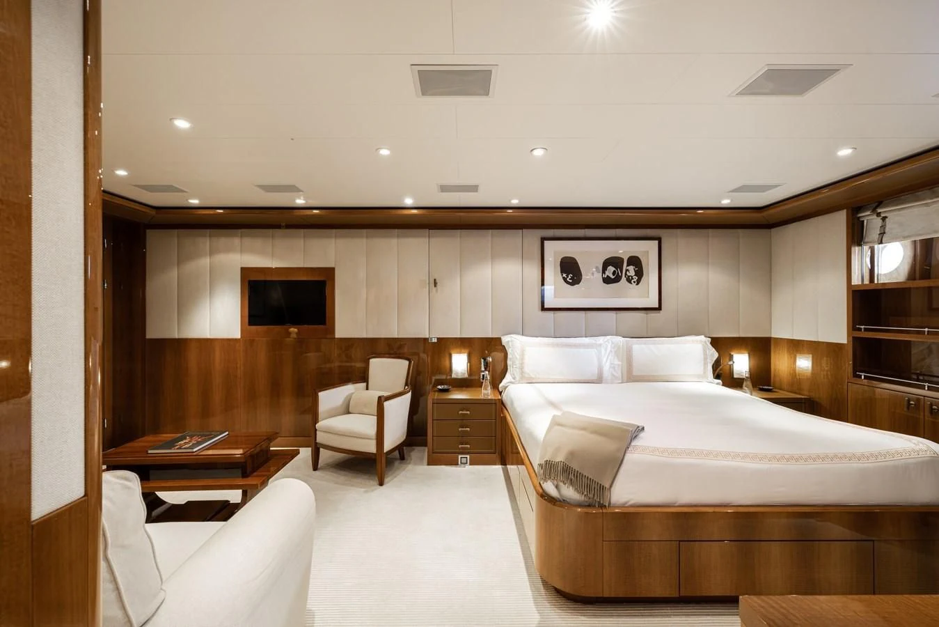 a room with a bed and a chair aboard BATELLO Yacht for Sale