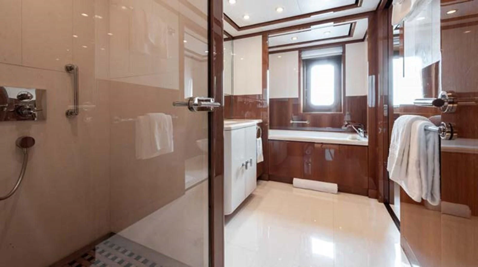 a bathroom with a shower and sink aboard BATELLO Yacht for Sale