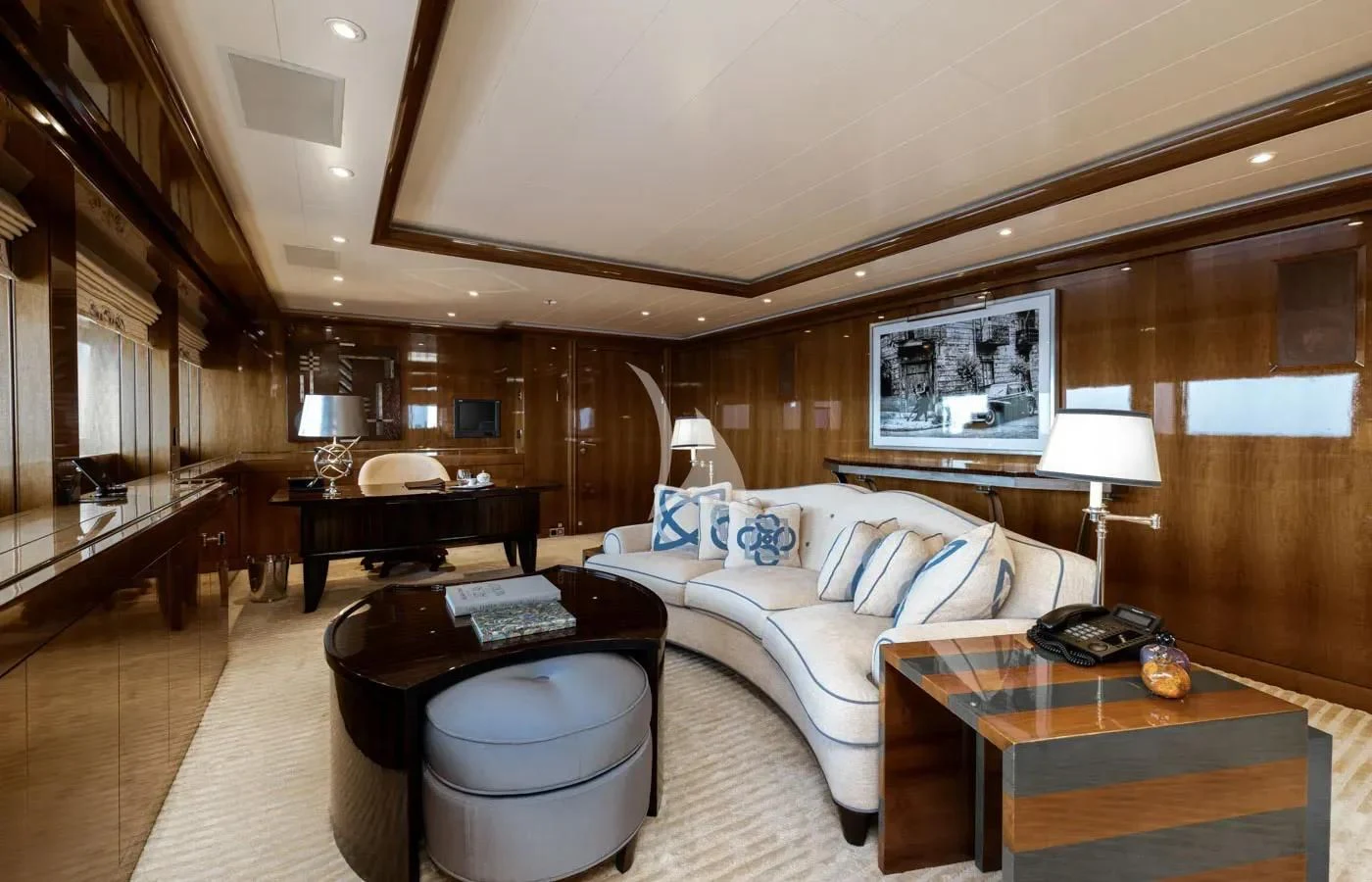 a bedroom with a bed and a desk aboard BATELLO Yacht for Sale