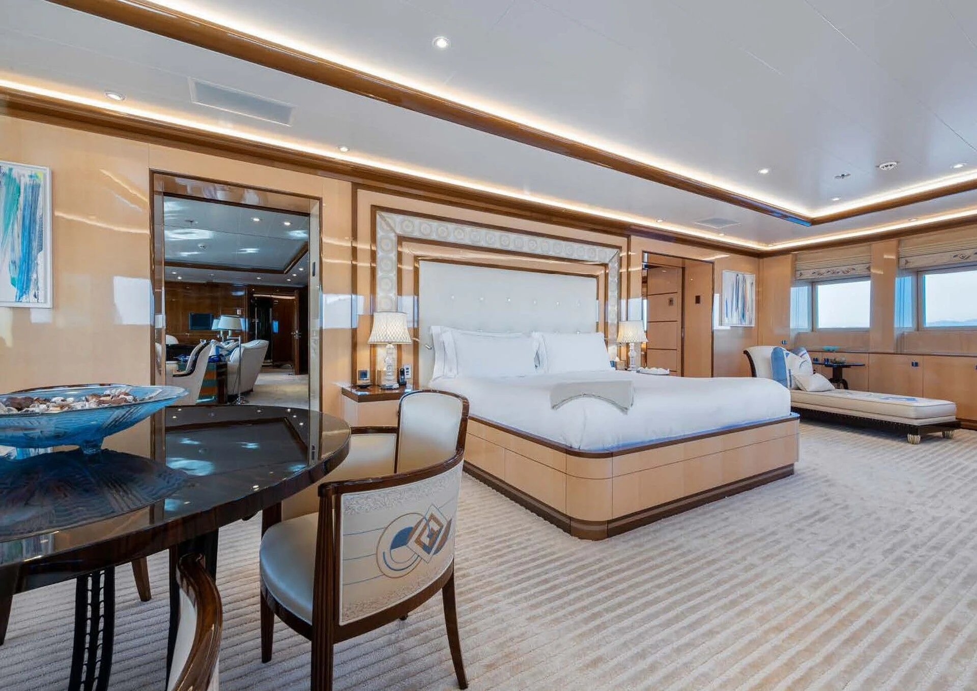a bedroom with a bed and a desk aboard BATELLO Yacht for Sale