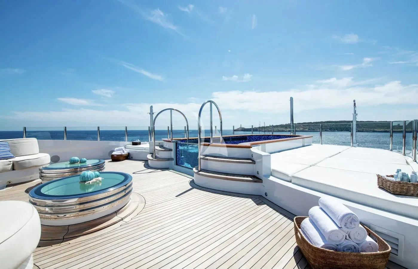 a deck with a view of the ocean and boats aboard BATELLO Yacht for Sale