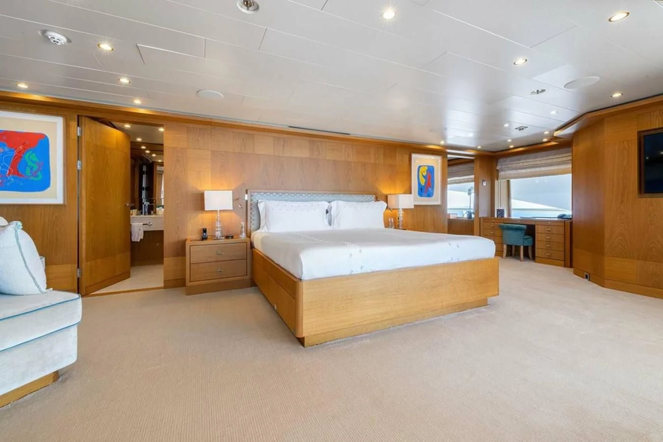 a large bedroom with a large bed aboard BATELLO Yacht for Sale