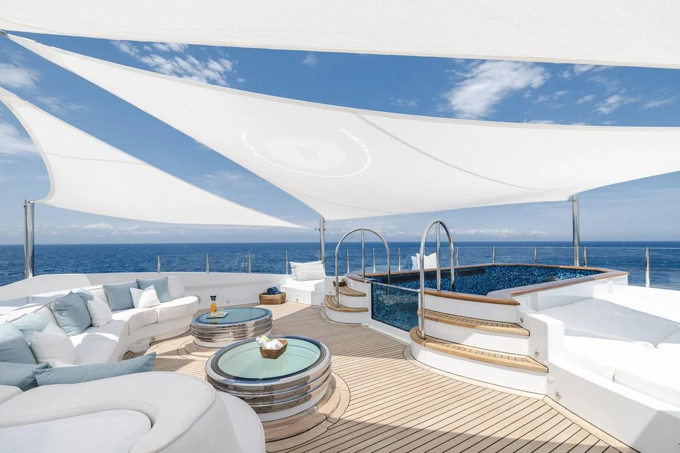 a large white tent with a table and chairs on it aboard BATELLO Yacht for Sale