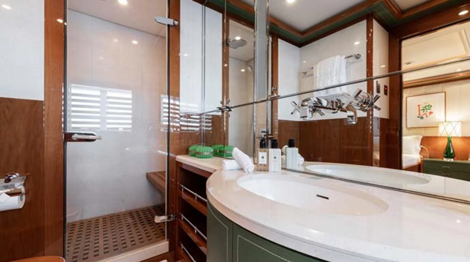 a bathroom with a large mirror aboard BATELLO Yacht for Sale