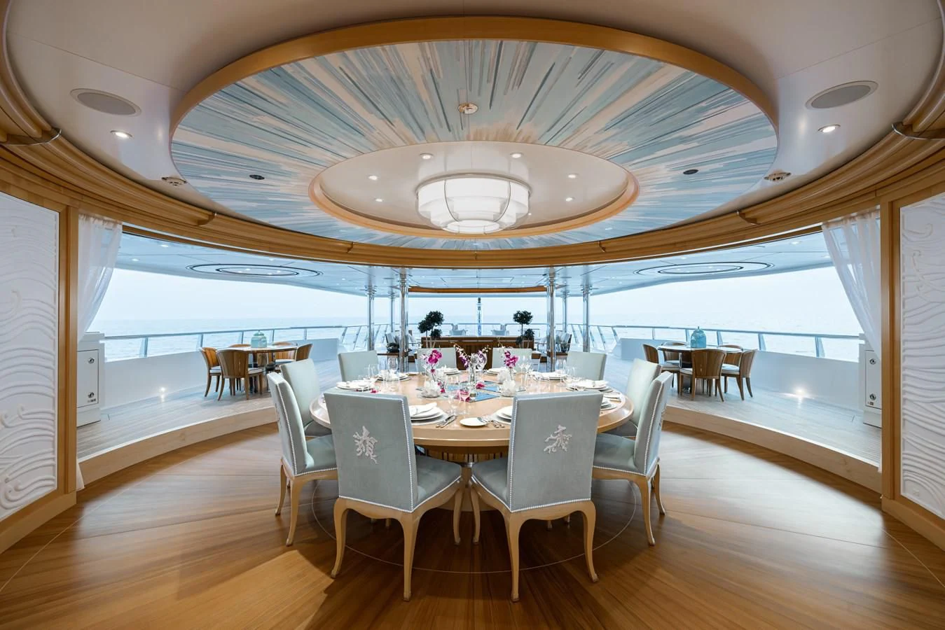 a dining room with a table and chairs aboard BATELLO Yacht for Sale