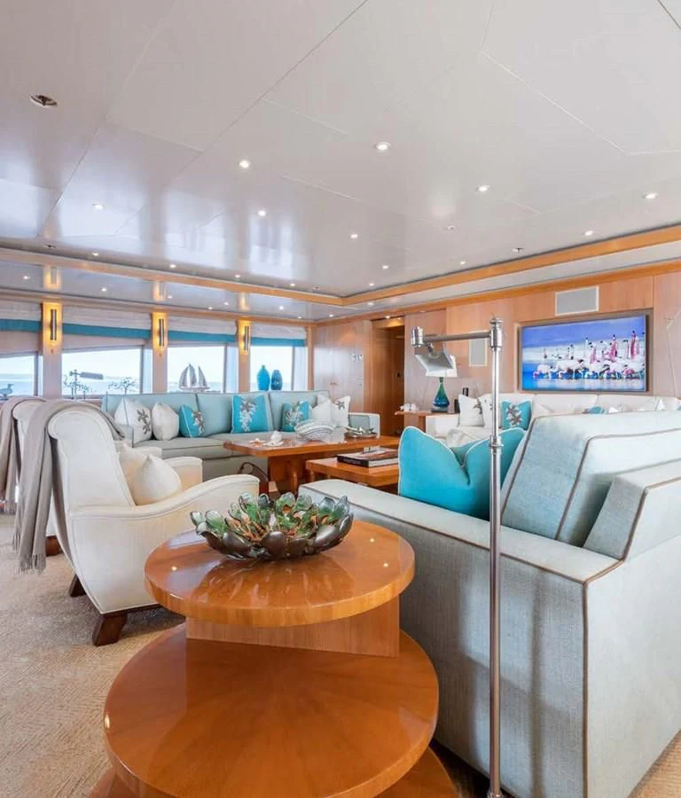 a living room with a couch and a table aboard BATELLO Yacht for Sale