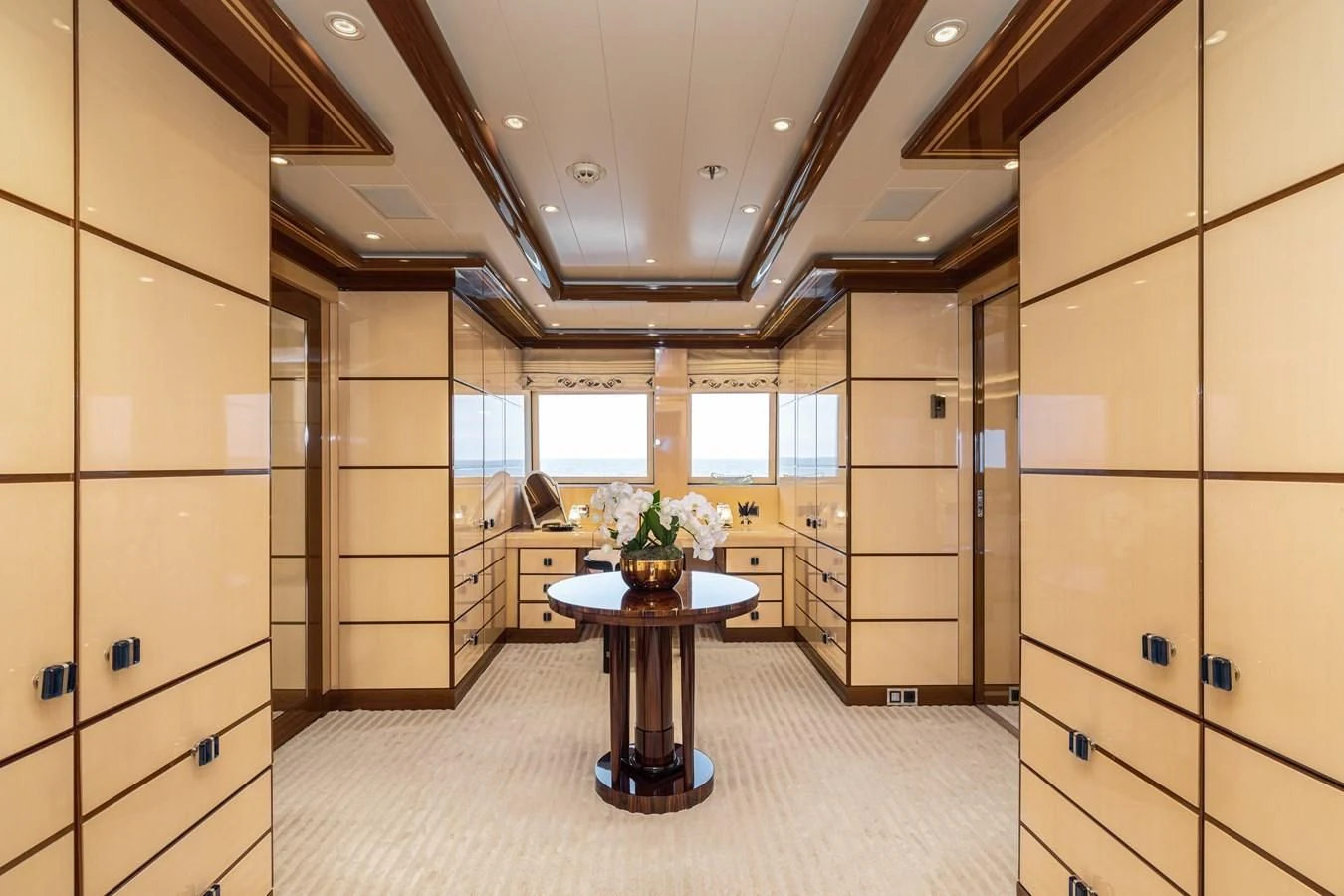 a room with a table and cabinets aboard BATELLO Yacht for Sale