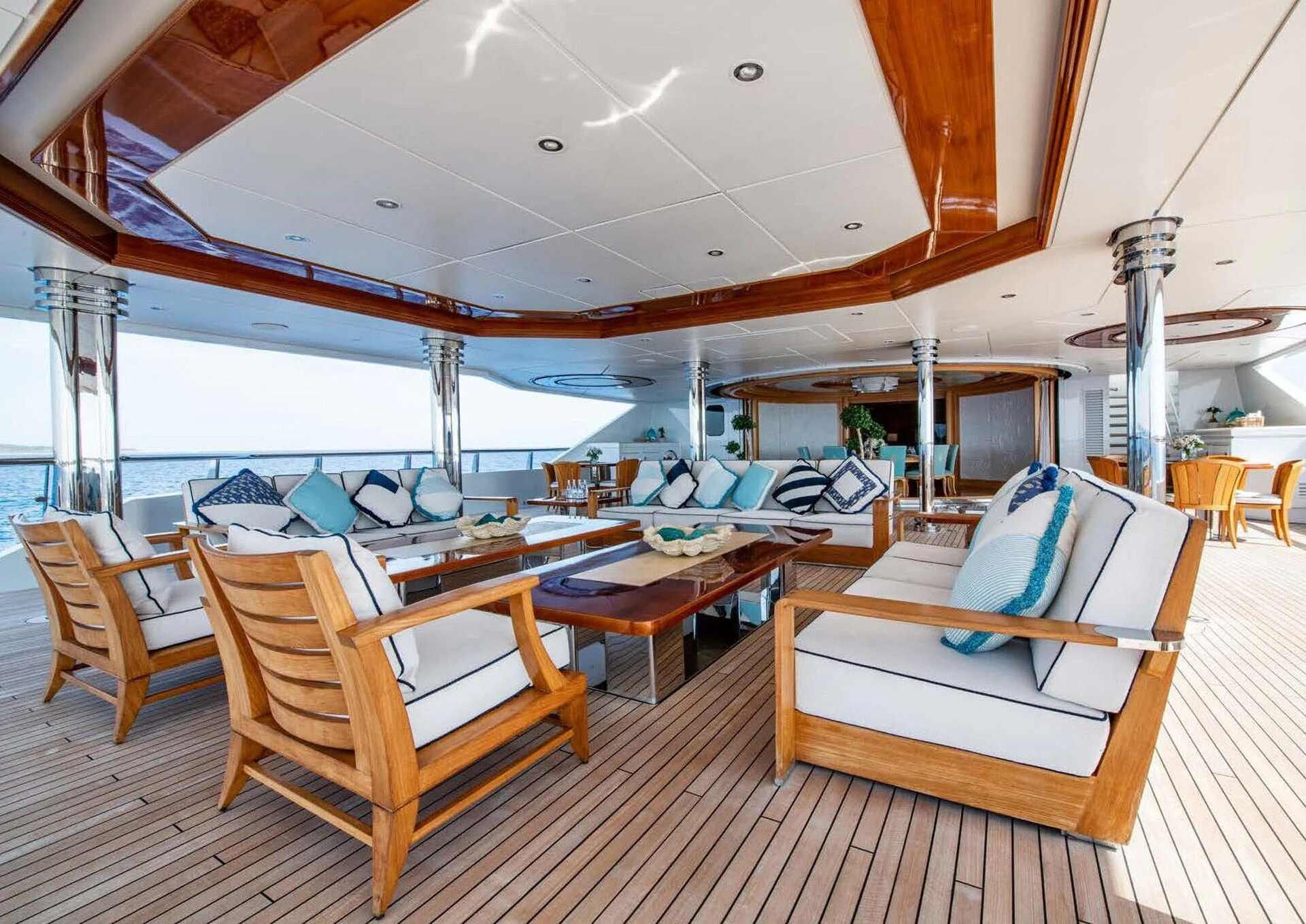 a room with a couch and a table and chairs aboard BATELLO Yacht for Sale
