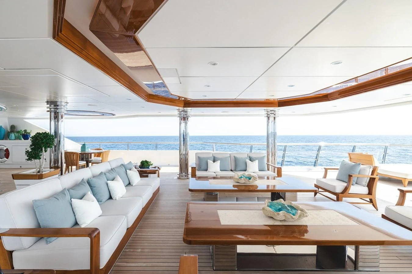 a room with a table and chairs aboard BATELLO Yacht for Sale