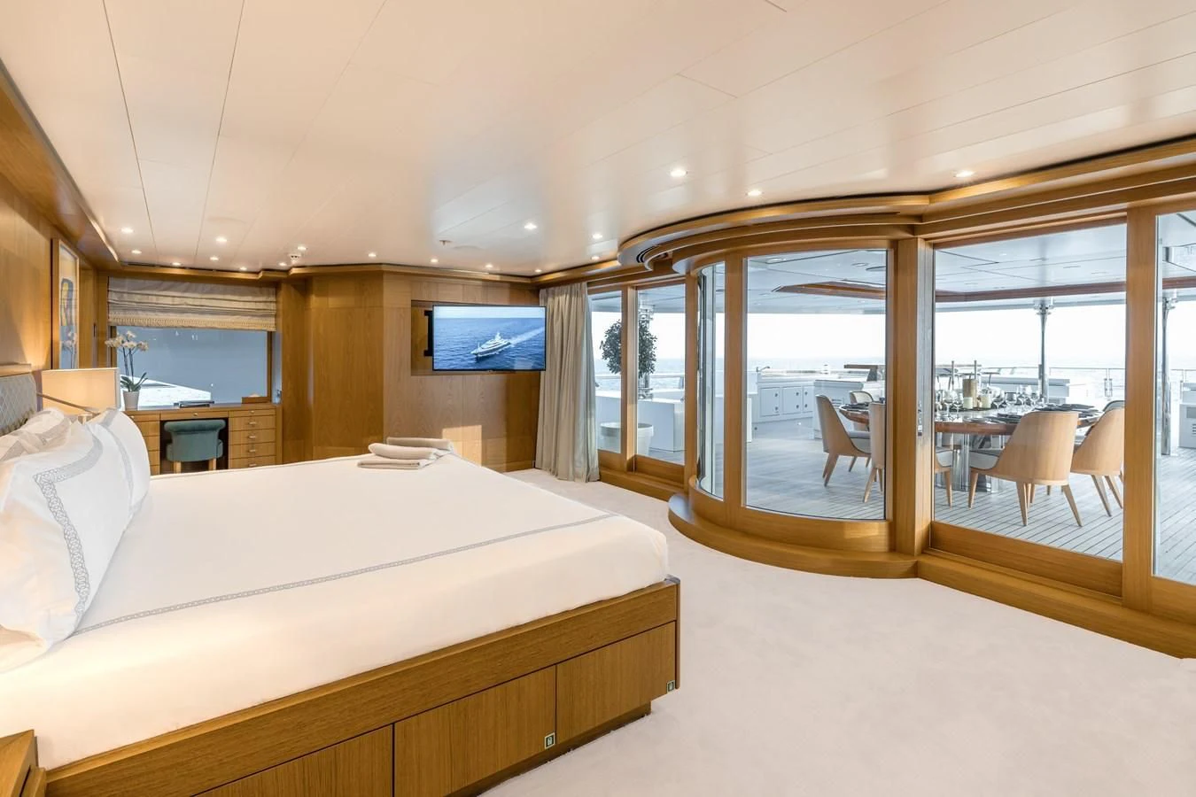 a hotel room with a bed and a tv aboard BATELLO Yacht for Sale