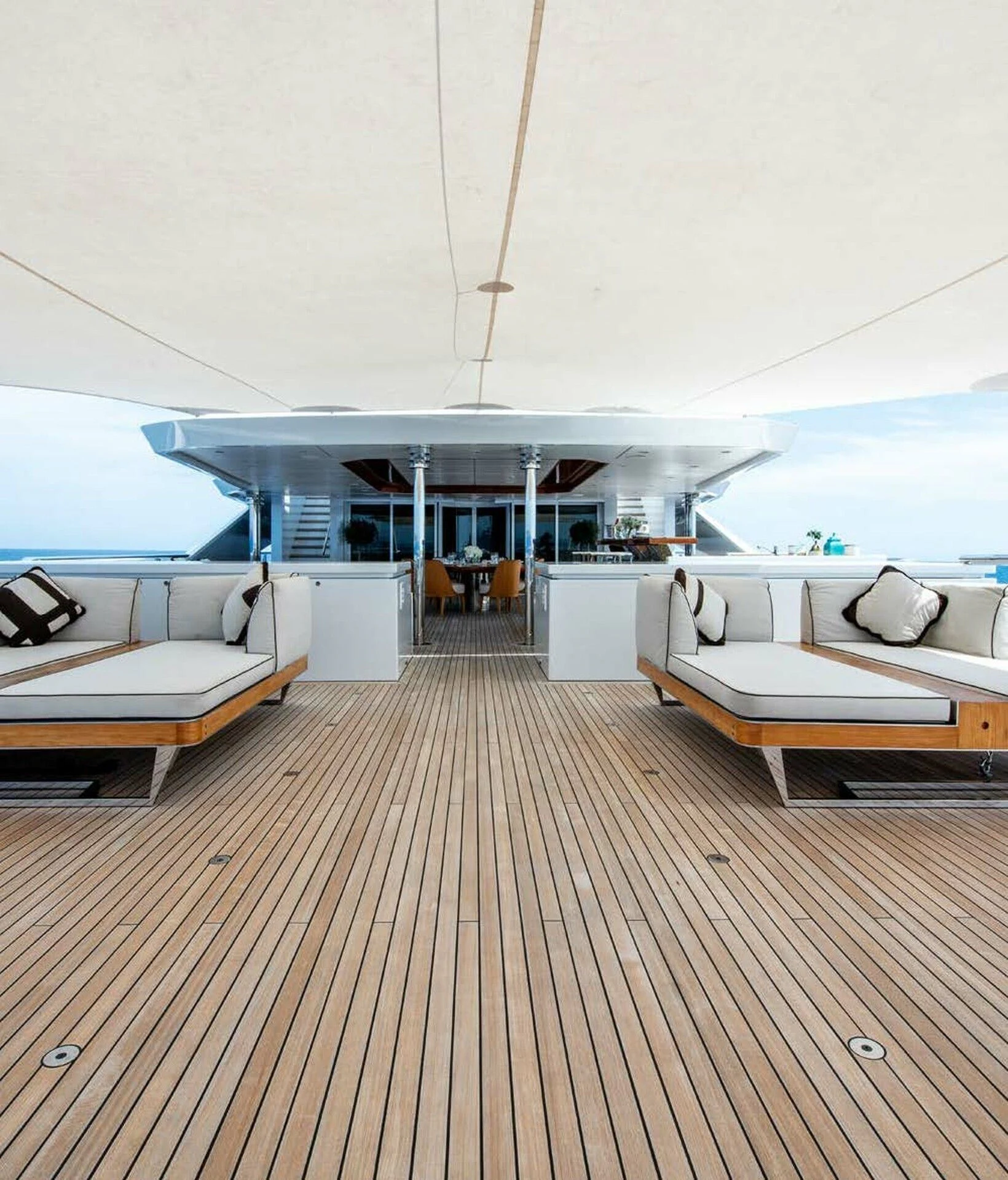 a room with a wood floor and a large white building with a large white roof and a large aboard BATELLO Yacht for Sale